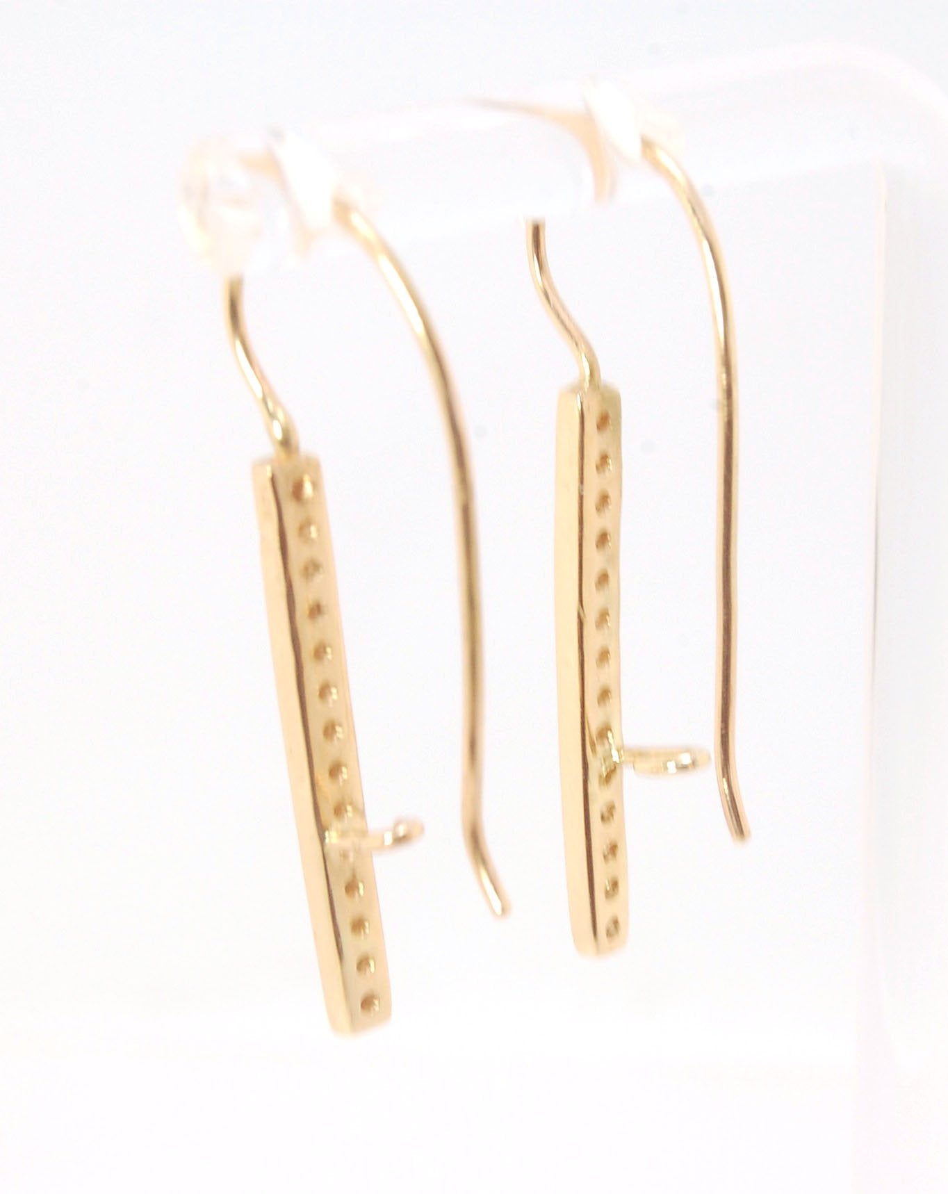 Long Diamond Earrings with french hook and clasp - 14k yellow gold These great little sparklers are subtle enough for every day as long as you don’t mind everyone noticing! They have 14 x 1.3mm colorless diamonds in a single pave row. Earrings have a fren