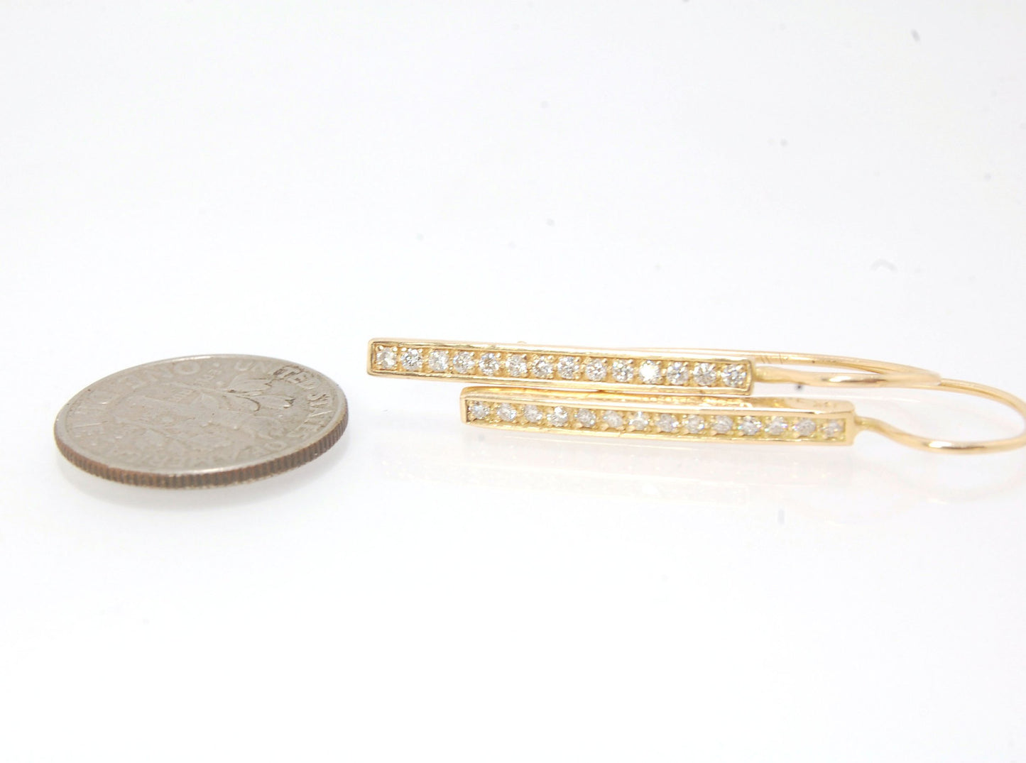 Long Diamond Earrings with french hook and clasp - 14k yellow gold These great little sparklers are subtle enough for every day as long as you don’t mind everyone noticing! They have 14 x 1.3mm colorless diamonds in a single pave row. Earrings have a fren