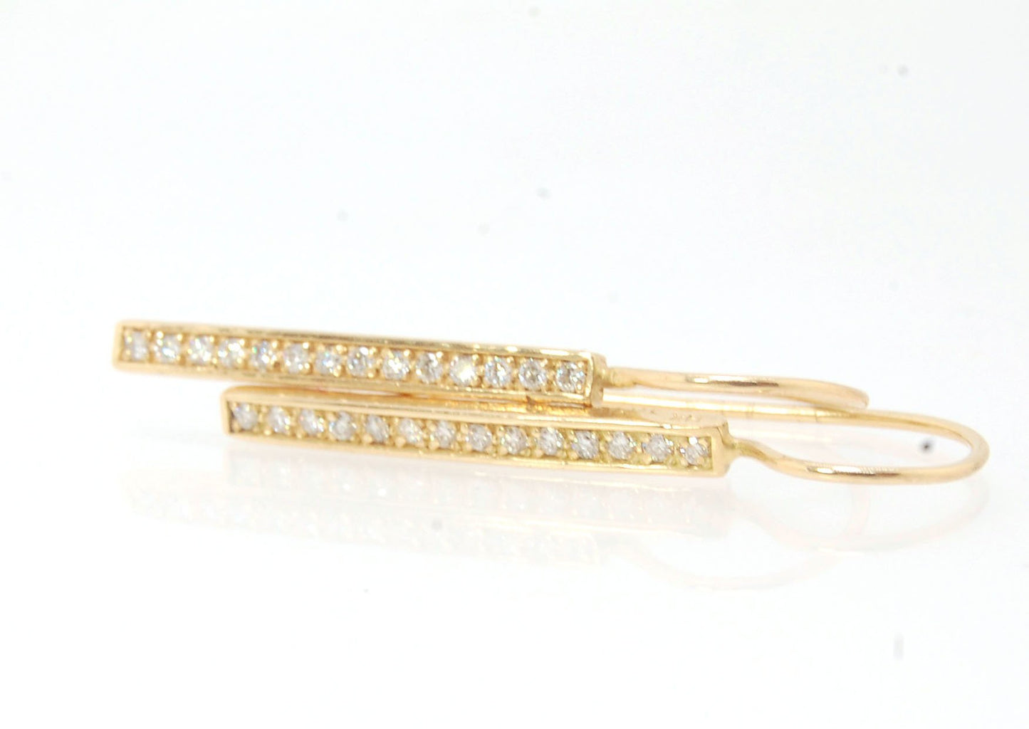 Long Diamond Earrings with french hook and clasp - 14k yellow gold These great little sparklers are subtle enough for every day as long as you don’t mind everyone noticing! They have 14 x 1.3mm colorless diamonds in a single pave row. Earrings have a fren