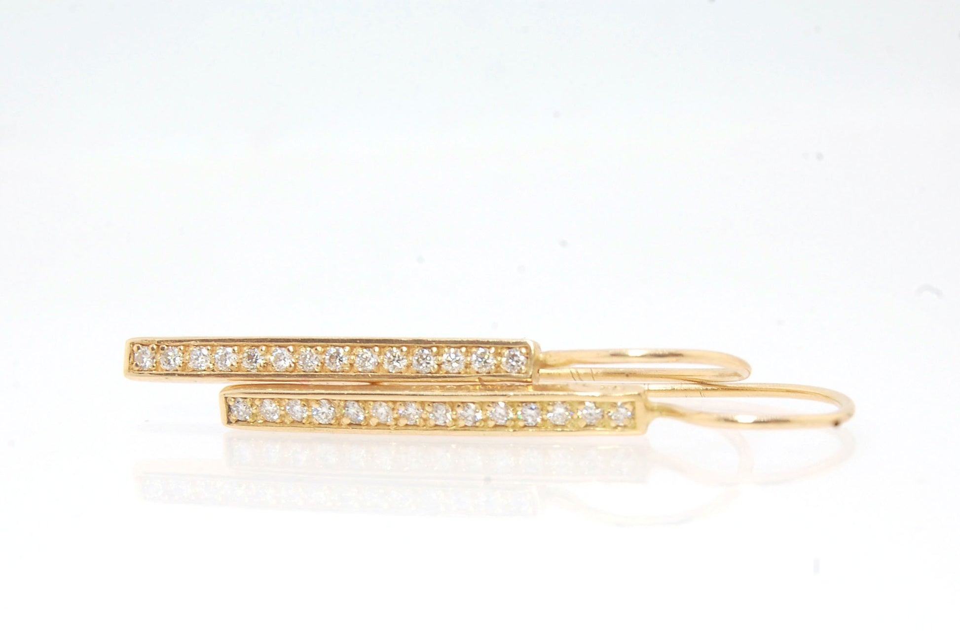 Long Diamond Earrings with french hook and clasp - 14k yellow gold These great little sparklers are subtle enough for every day as long as you don’t mind everyone noticing! They have 14 x 1.3mm colorless diamonds in a single pave row. Earrings have a fren