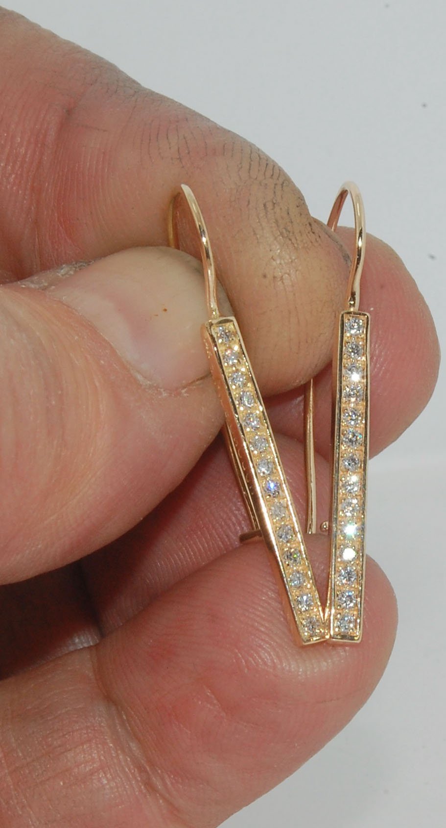 Long Diamond Earrings with french hook and clasp - 14k yellow gold These great little sparklers are subtle enough for every day as long as you don’t mind everyone noticing! They have 14 x 1.3mm colorless diamonds in a single pave row. Earrings have a fren