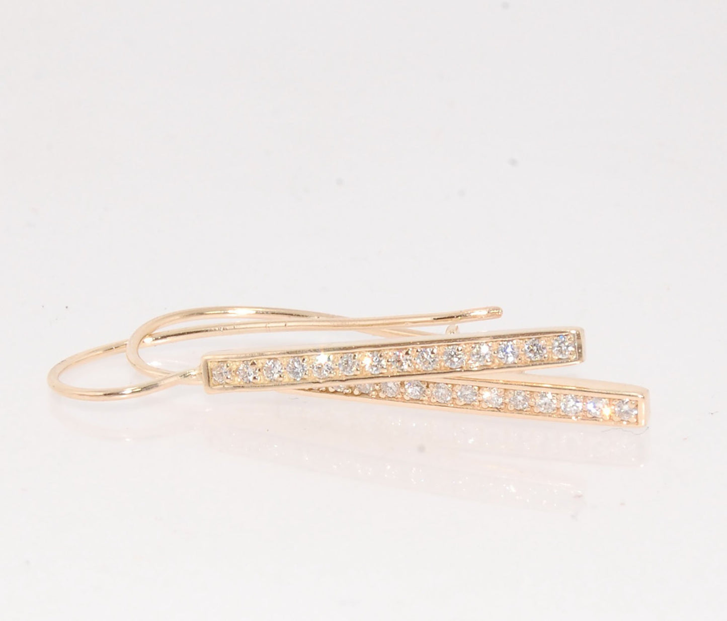 Long Diamond Earrings with french hook and clasp - 14k yellow gold These great little sparklers are subtle enough for every day as long as you don’t mind everyone noticing! They have 14 x 1.3mm colorless diamonds in a single pave row. Earrings have a fren