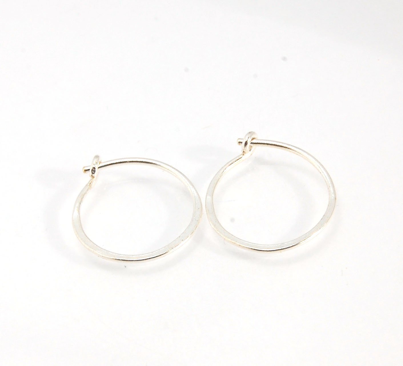 Hammered Hoops - Sterling - Small, Medium and Large Looking for an affordable handmade gift? Or some super lightweight Sterling Silver Hoops you can live in? These classic wire hammered hoops you can sleep and live in are forged from 20 gage Sterling wire