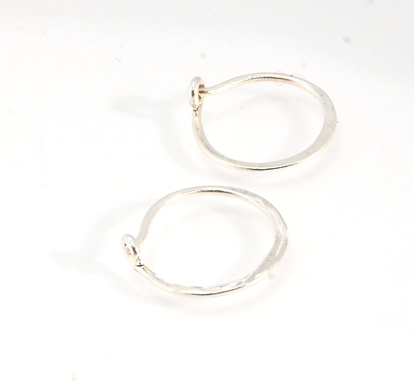 Hammered Hoops - Sterling - Small, Medium and Large Looking for an affordable handmade gift? Or some super lightweight Sterling Silver Hoops you can live in? These classic wire hammered hoops you can sleep and live in are forged from 20 gage Sterling wire