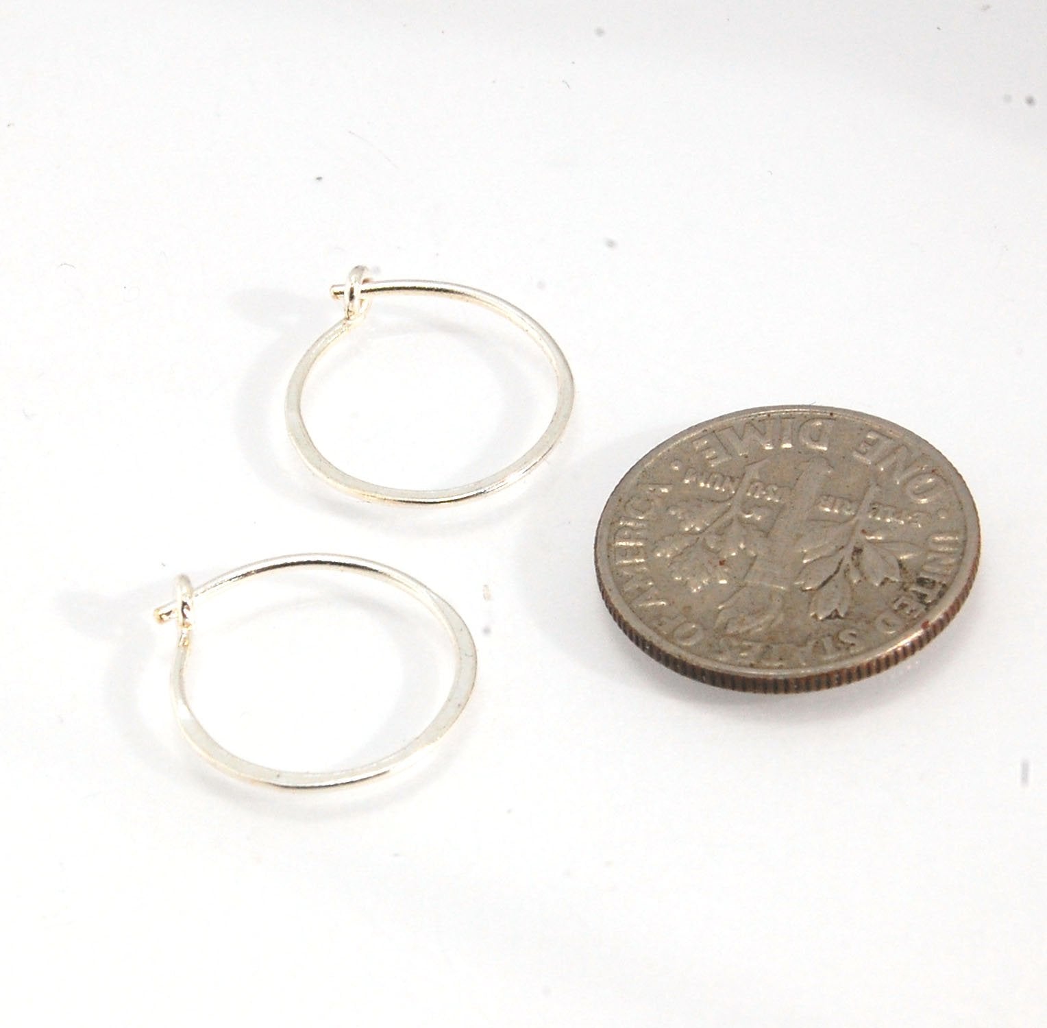 Hammered Hoops - Sterling - Small, Medium and Large Looking for an affordable handmade gift? Or some super lightweight Sterling Silver Hoops you can live in? These classic wire hammered hoops you can sleep and live in are forged from 20 gage Sterling wire