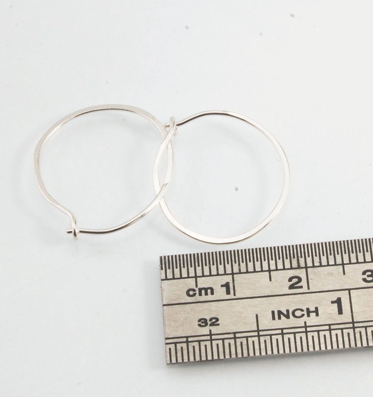 Hammered Hoops - Sterling - Small, Medium and Large Looking for an affordable handmade gift? Or some super lightweight Sterling Silver Hoops you can live in? These classic wire hammered hoops you can sleep and live in are forged from 20 gage Sterling wire