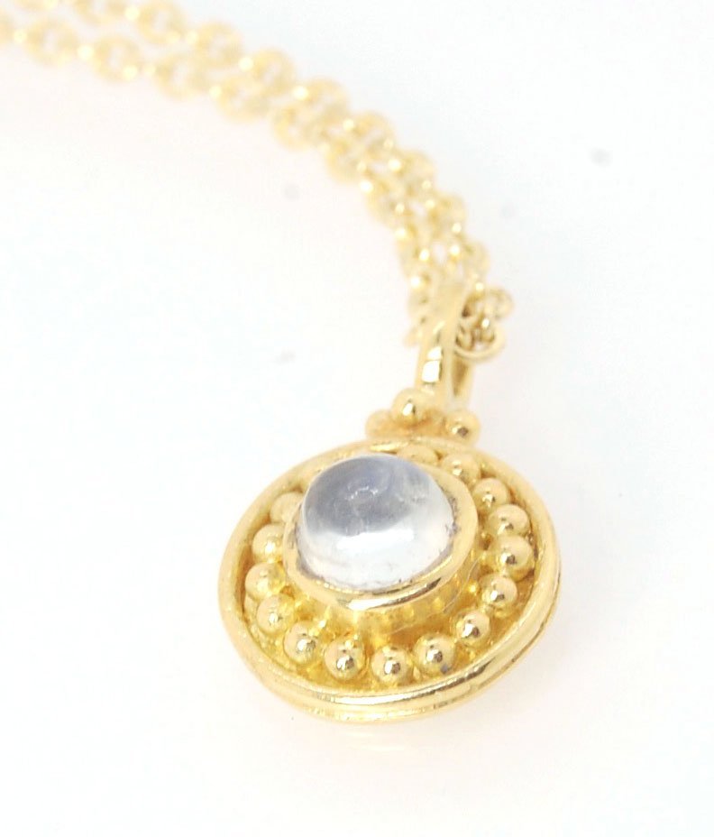 Tiny Round Rainbow Moonstone 18k gold Granulated Pendant This beautiful tiny round rainbow moonstone has so much luminance! A bezel-set small round rainbow moonstone is surrounded by larger 18k gold granules and can be ordered on the your chain of choice.