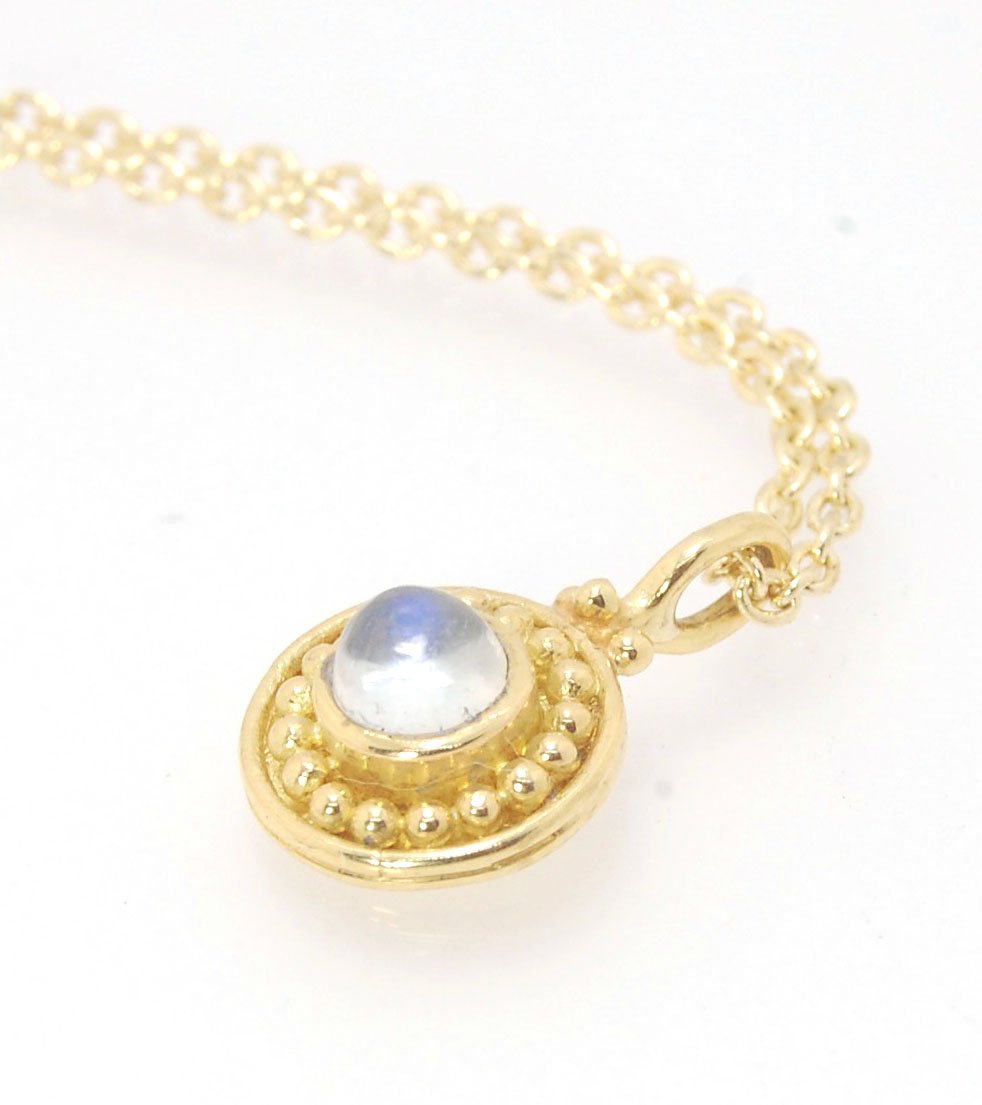 Tiny Round Rainbow Moonstone 18k gold Granulated Pendant This beautiful tiny round rainbow moonstone has so much luminance! A bezel-set small round rainbow moonstone is surrounded by larger 18k gold granules and can be ordered on the your chain of choice.