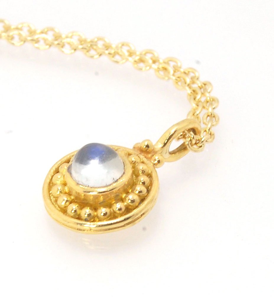 Tiny Round Rainbow Moonstone 18k gold Granulated Pendant This beautiful tiny round rainbow moonstone has so much luminance! A bezel-set small round rainbow moonstone is surrounded by larger 18k gold granules and can be ordered on the your chain of choice.