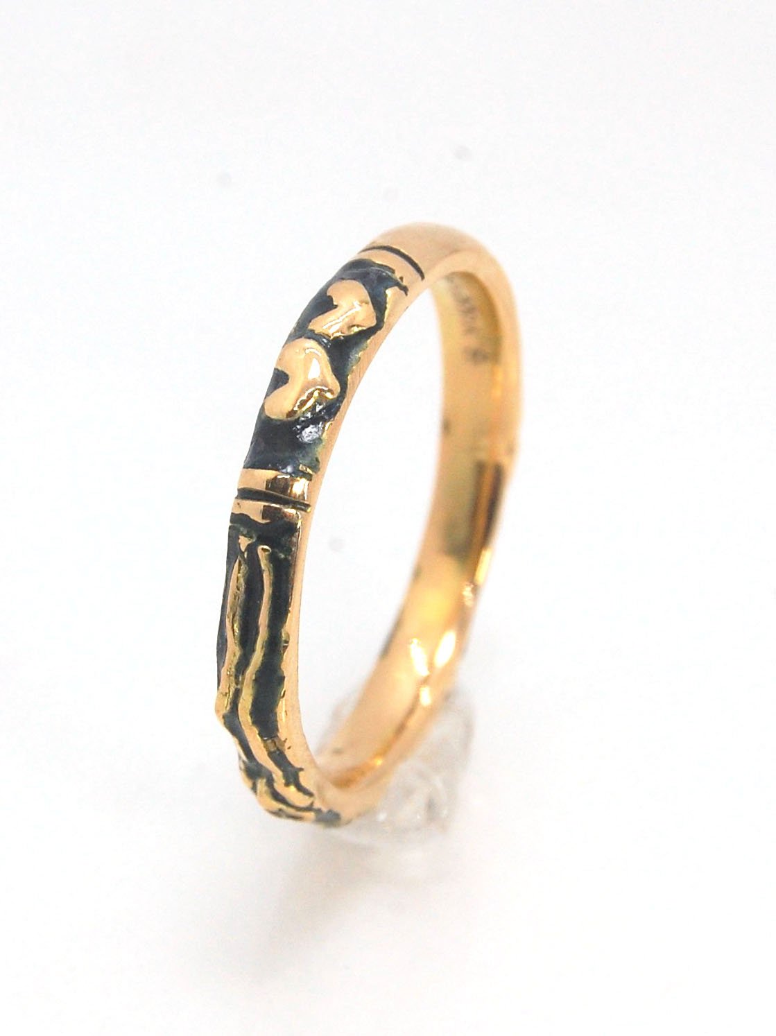 Memento Mori Skeleton Ring in 14k gold - 3mm This is the most narrow of my Memento Mori rings at 3mm wide and is cast in 14k rich yellow gold. The Skeleton is flanked by intertwined hearts on one side.14k rich yellow gold and EnamelMade to Order. Usually