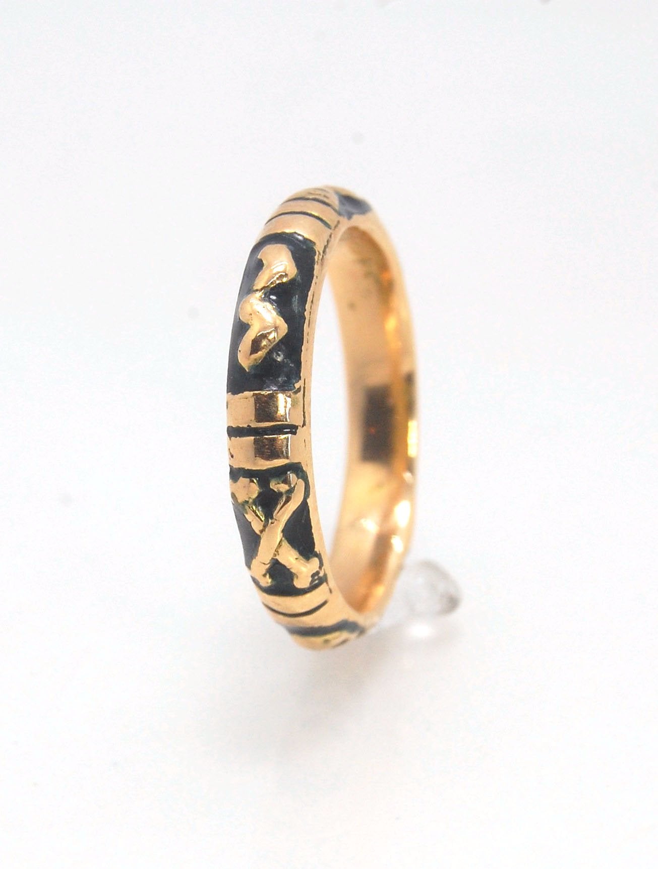 Memento Mori Skeleton Ring in 14k gold with enamel - Medium - 4mm This is the middle width of my Memento Mori skeleton rings at 4mm wide and cast in 14k rich yellow gold. The Skeleton is flanked by crossed bones on one side and an hourglass on the other.1