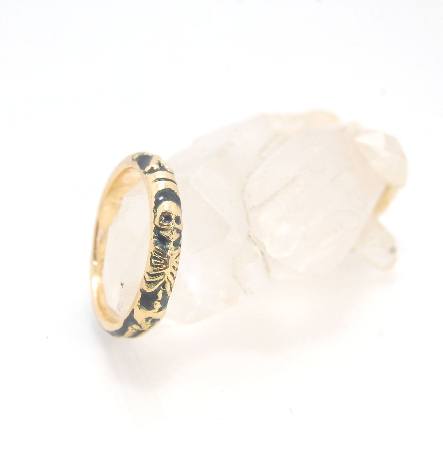 Memento Mori Skeleton Ring in 14k gold with enamel - Medium - 4mm This is the middle width of my Memento Mori skeleton rings at 4mm wide and cast in 14k rich yellow gold. The Skeleton is flanked by crossed bones on one side and an hourglass on the other.1