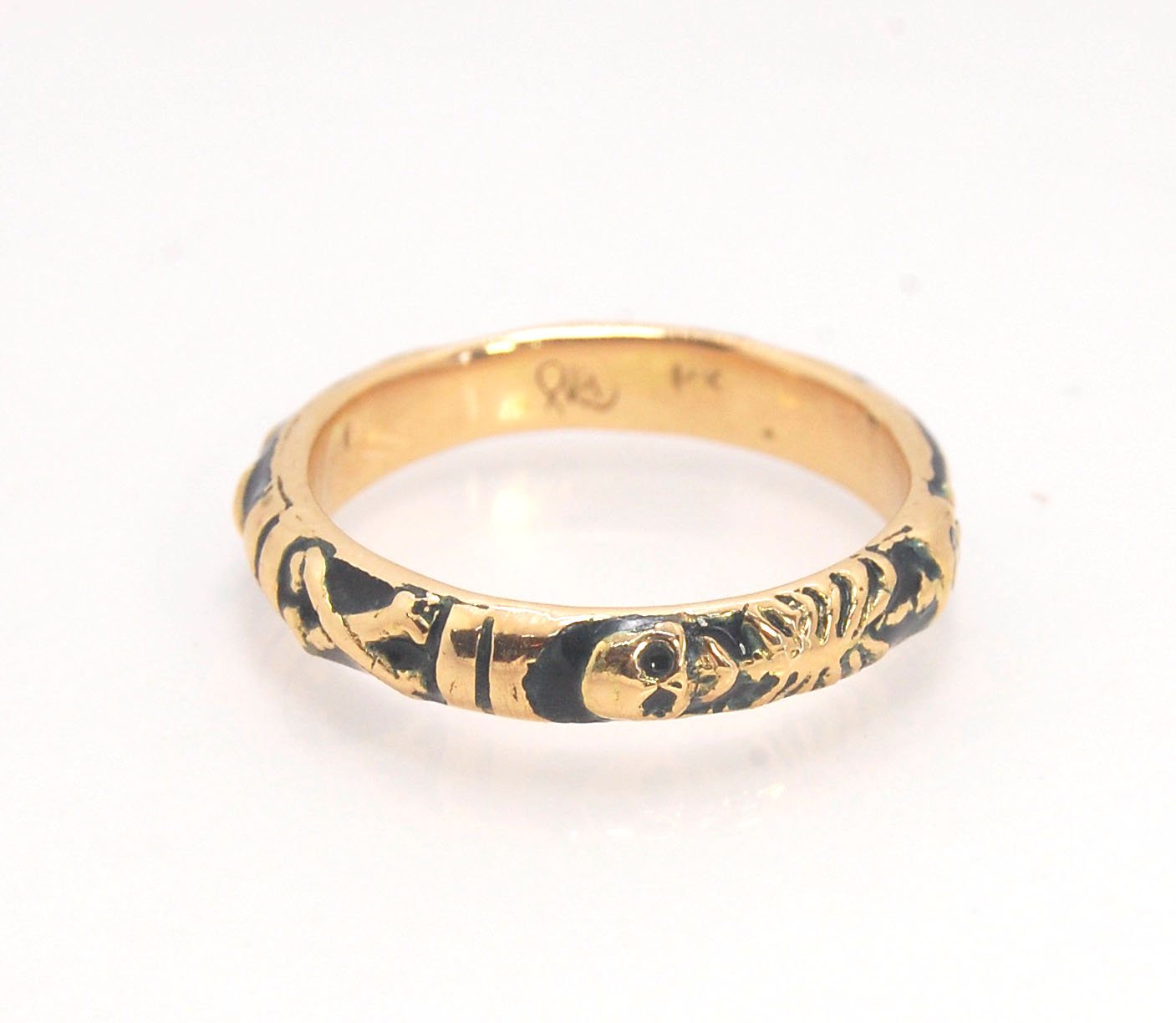 Memento Mori Skeleton Ring in 14k gold with enamel - Medium - 4mm This is the middle width of my Memento Mori skeleton rings at 4mm wide and cast in 14k rich yellow gold. The Skeleton is flanked by crossed bones on one side and an hourglass on the other.1