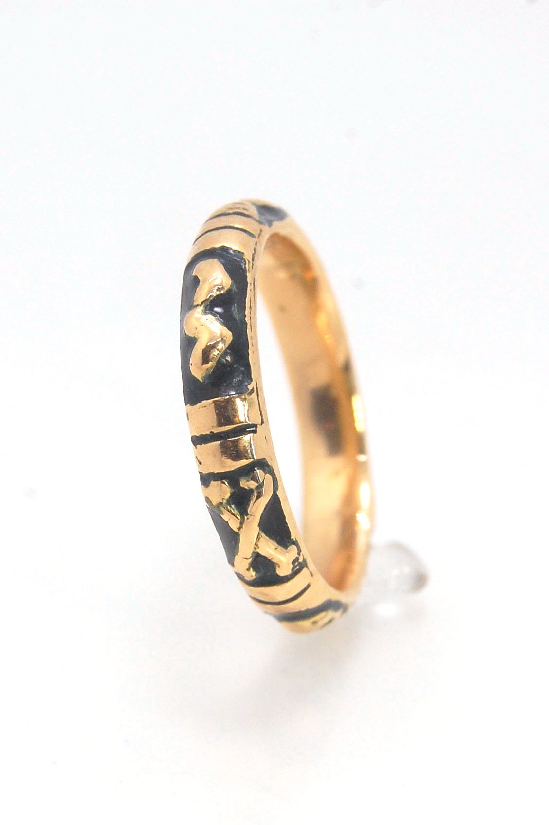 Memento Mori Skeleton Ring in 14k gold with enamel - Medium - 4mm This is the middle width of my Memento Mori skeleton rings at 4mm wide and cast in 14k rich yellow gold. The Skeleton is flanked by crossed bones on one side and an hourglass on the other.1