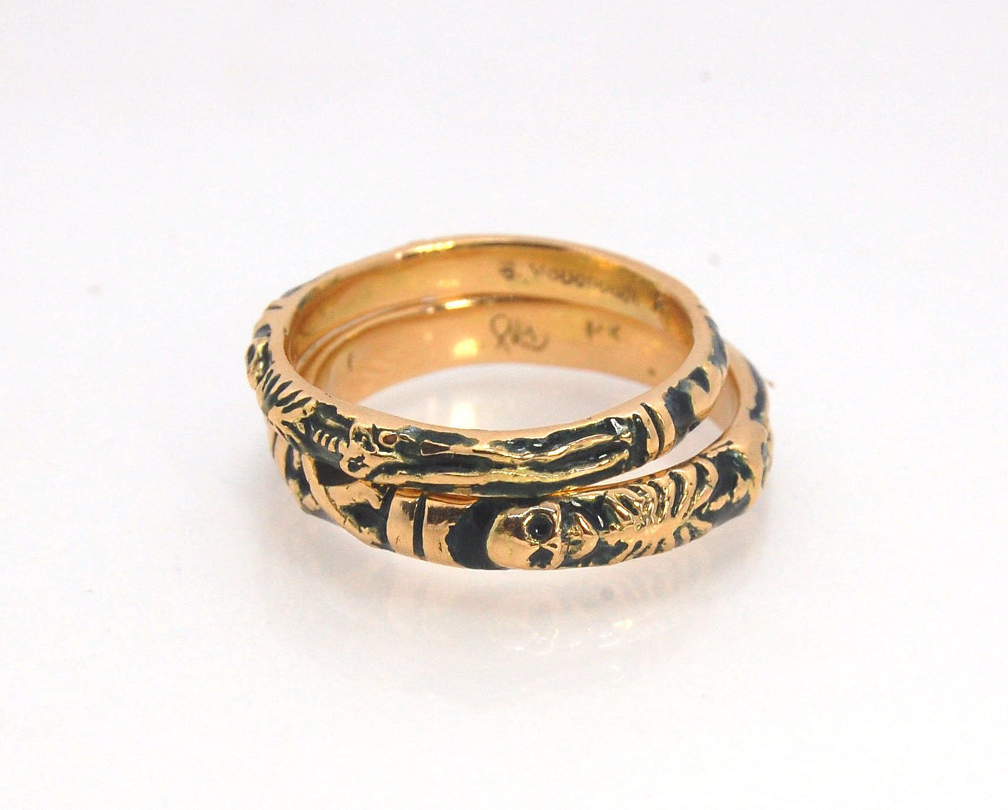 Memento Mori Skeleton Ring in 14k gold - 3mm This is the most narrow of my Memento Mori rings at 3mm wide and is cast in 14k rich yellow gold. The Skeleton is flanked by intertwined hearts on one side.14k rich yellow gold and EnamelMade to Order. Usually