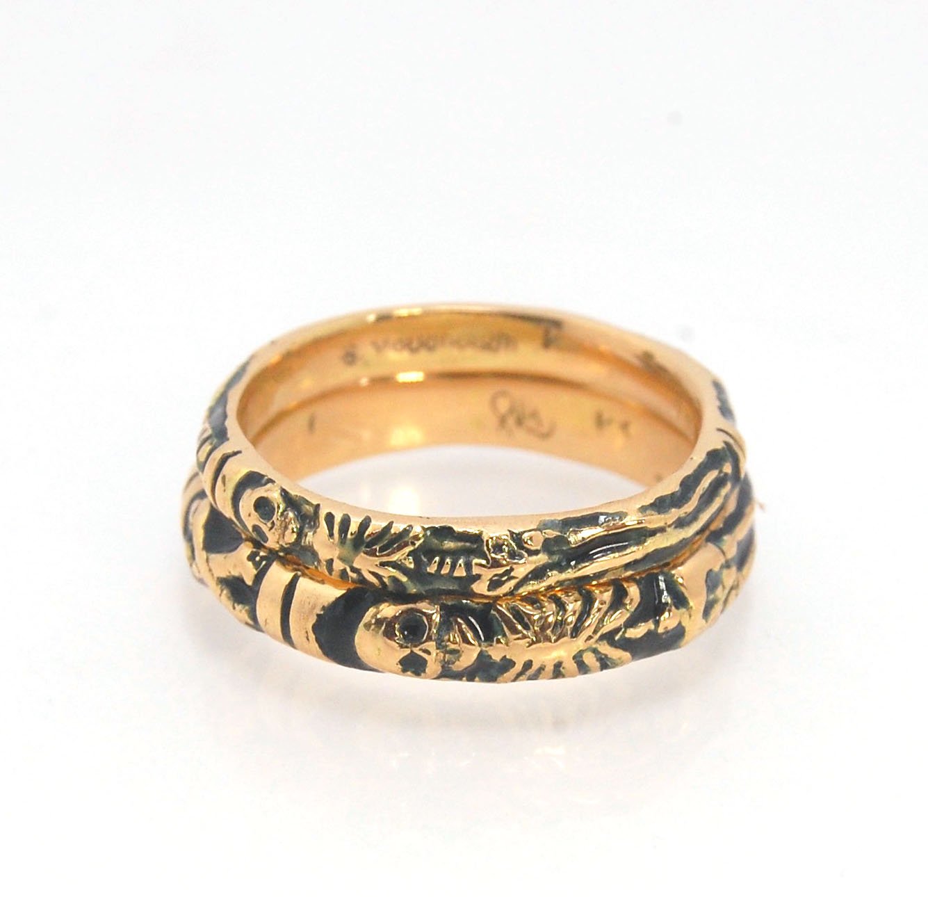 Memento Mori Skeleton Ring in 14k gold - 3mm This is the most narrow of my Memento Mori rings at 3mm wide and is cast in 14k rich yellow gold. The Skeleton is flanked by intertwined hearts on one side.14k rich yellow gold and EnamelMade to Order. Usually