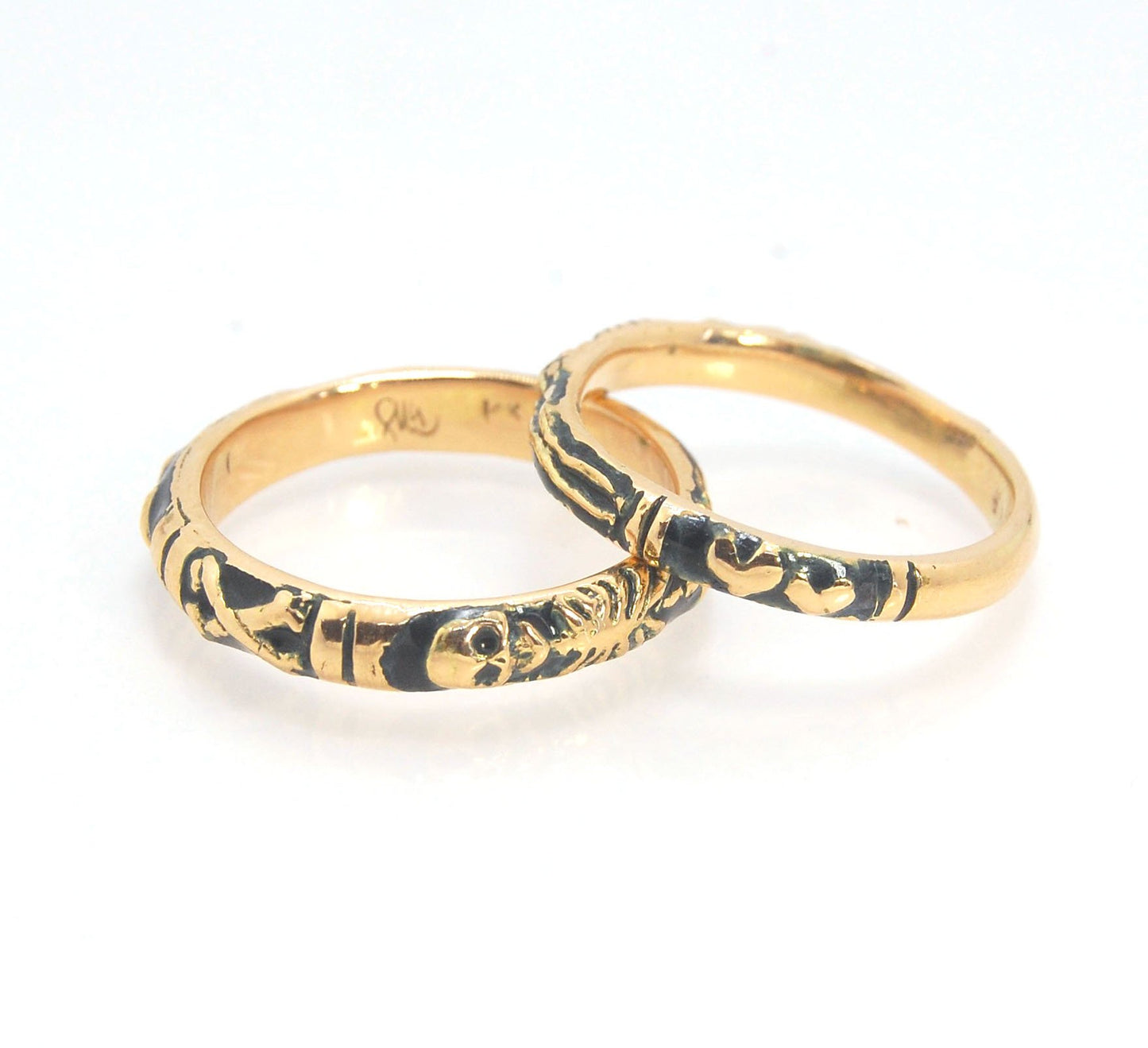 Memento Mori Skeleton Ring in 14k gold - 3mm This is the most narrow of my Memento Mori rings at 3mm wide and is cast in 14k rich yellow gold. The Skeleton is flanked by intertwined hearts on one side.14k rich yellow gold and EnamelMade to Order. Usually