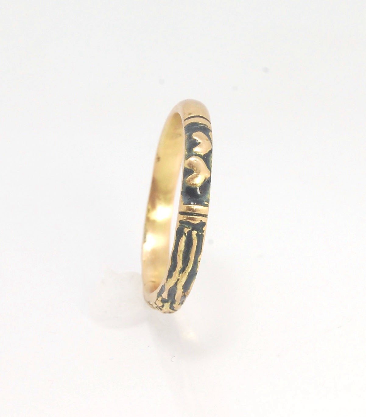 Memento Mori Skeleton Ring in 14k gold - 3mm This is the most narrow of my Memento Mori rings at 3mm wide and is cast in 14k rich yellow gold. The Skeleton is flanked by intertwined hearts on one side.14k rich yellow gold and EnamelMade to Order. Usually