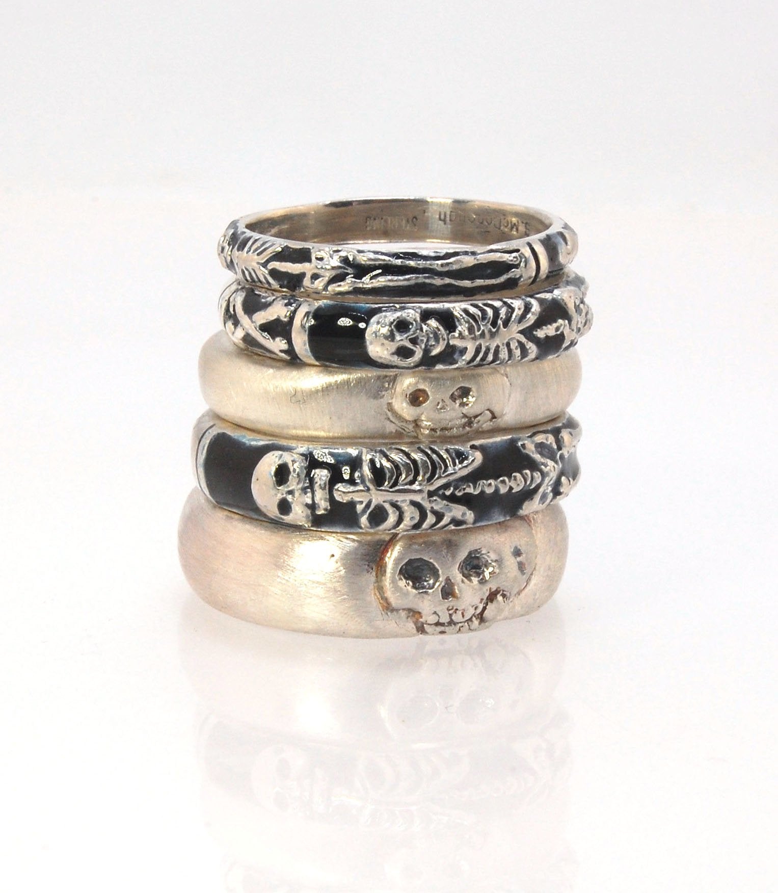 Memento Mori Skeleton Ring - Medium - 4mm - Enameled This is the middle width of my Memento Mori skeleton rings at 4mm wide. The Skeleton is flanked by crossed bones on one side and an hourglass on the other. Each ring in this collection is carved in wax