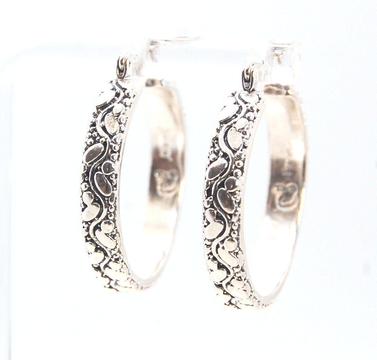 Oval Dots Hoop Earrings - Sterling Silver in 3 sizes These Hoops are made from an Oval and Dot pattern 4.7 mm wide band with ovals and heavy granules around a wavy center line. I made the original band in Fine silver using the process of Granulation. I th