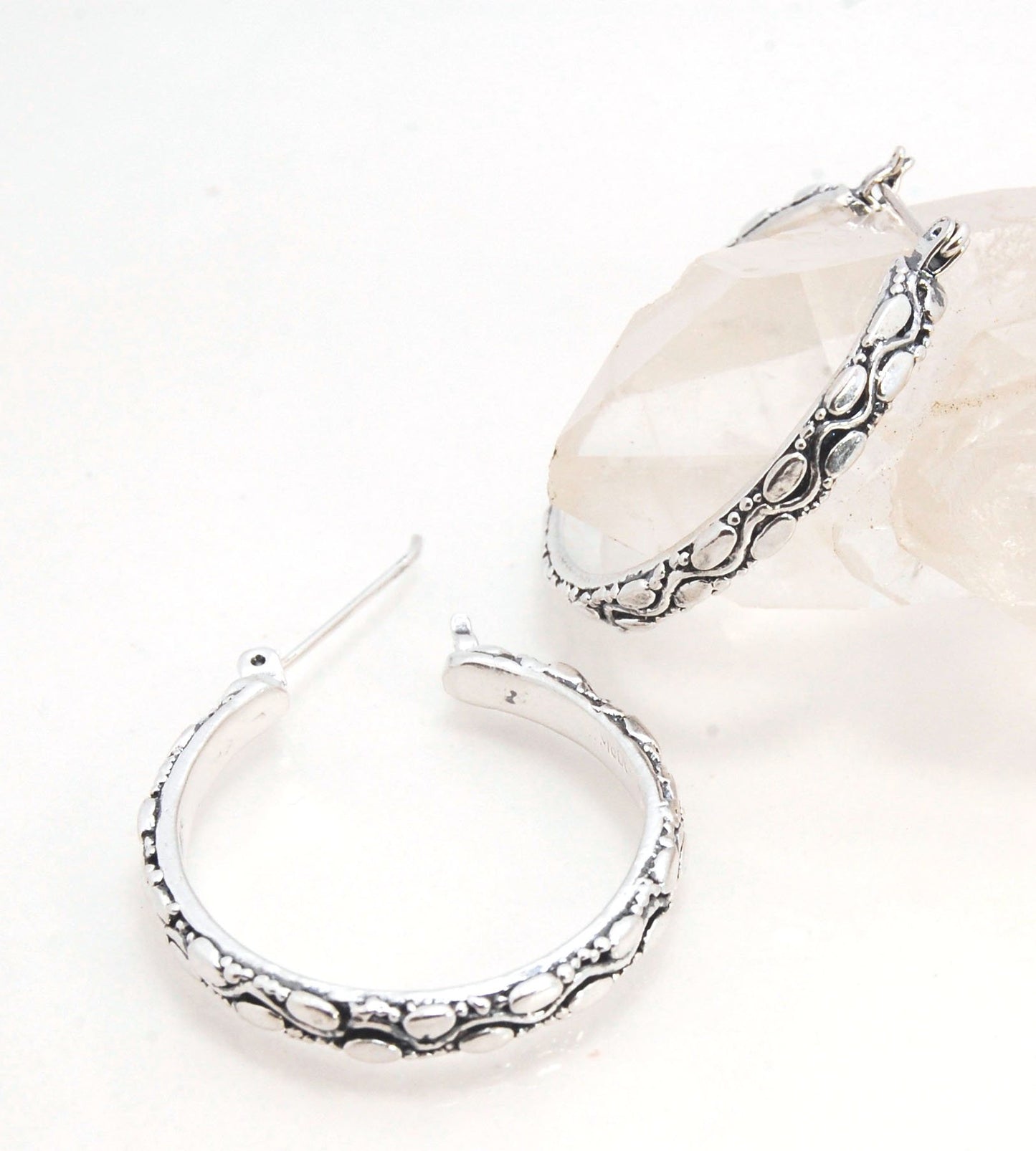 Ovals Pattern Hoops - Sterling in 3 sizes These Hoops are made from an Ovals pattern with heavy granules and ingot slices and have a hoop catch with a satisfying snap.These Ovals Hoops come in 3 sizes Large - 3mm wide and 1.25” in diameterMedium - 3mm wid