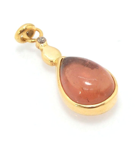 Peach Tourmaline and 1mm diamond Drop 14k gold pendant Peach Pink Drop Cabochon bezel-set in 14k gold with a 1.2mm tube-set champagne diamond on the chain of your choice. 8mm x 22mm14k gold, tourmaline and 1mm white diamondOne of a Kind