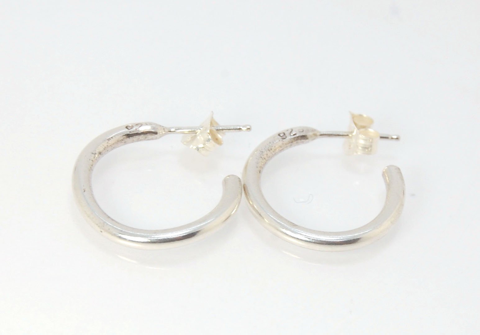 Solid Hoop Post Earrings - Medium - in Sterling These are a nice 3/4“ or 17mm wide post earrings. Made with a solid round rod of sterling silver and some solder posts, these simple and classy sterling silver posts have a nice light weight. Finished with a