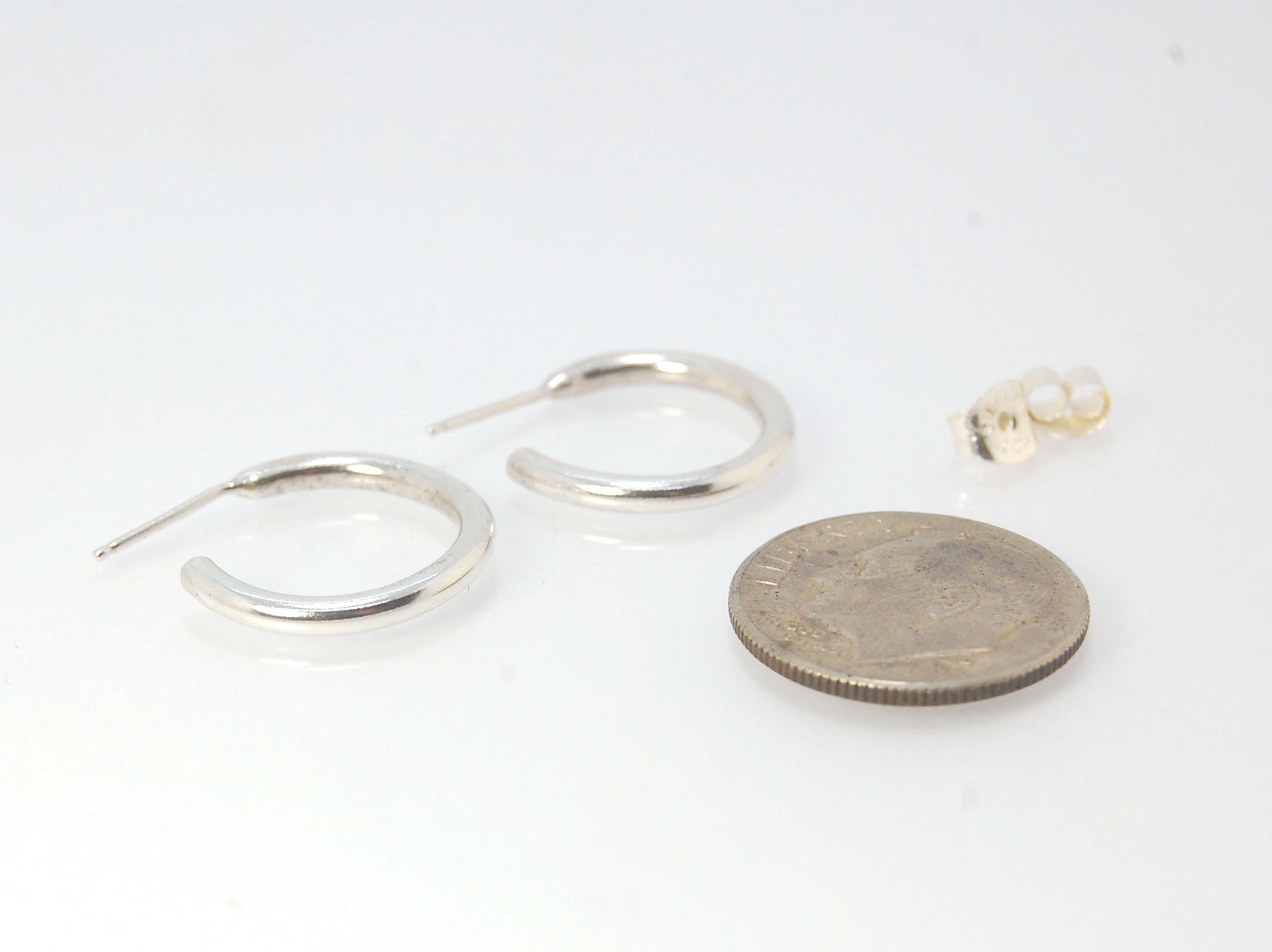 Solid Hoop Post Earrings - Medium - in Sterling These are a nice 3/4“ or 17mm wide post earrings. Made with a solid round rod of sterling silver and some solder posts, these simple and classy sterling silver posts have a nice light weight. Finished with a