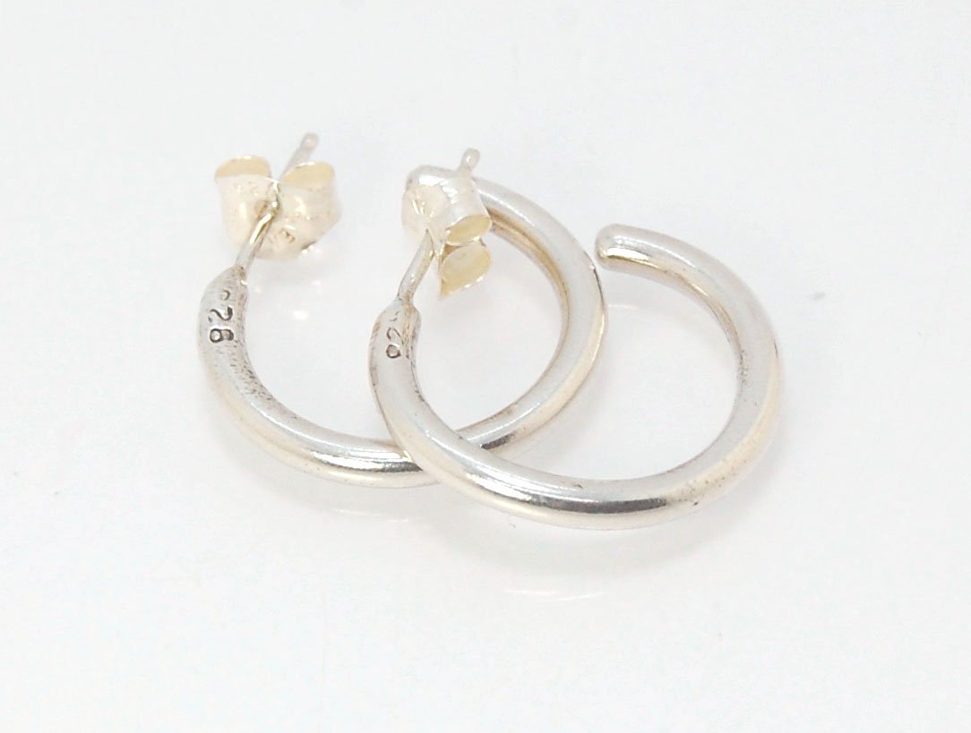 Solid Hoop Post Earrings - Medium - in Sterling These are a nice 3/4“ or 17mm wide post earrings. Made with a solid round rod of sterling silver and some solder posts, these simple and classy sterling silver posts have a nice light weight. Finished with a