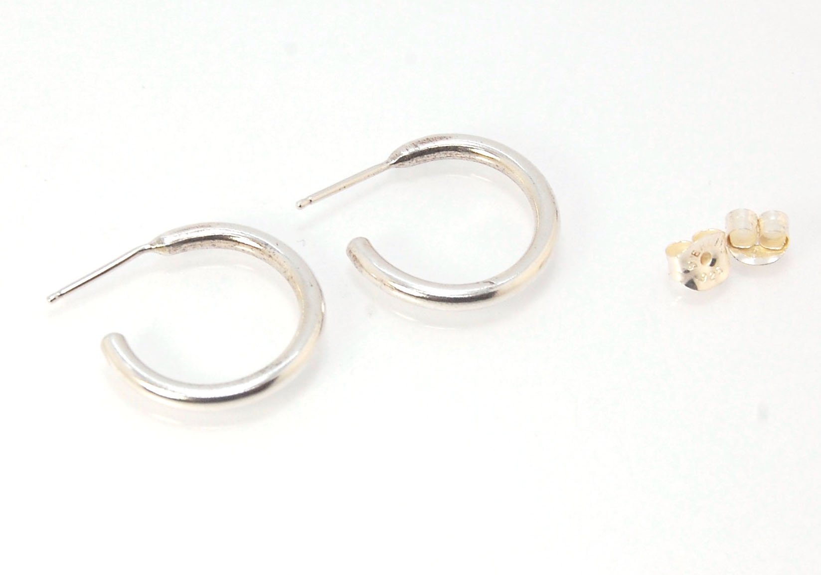 Solid Hoop Post Earrings - Medium - in Sterling These are a nice 3/4“ or 17mm wide post earrings. Made with a solid round rod of sterling silver and some solder posts, these simple and classy sterling silver posts have a nice light weight. Finished with a