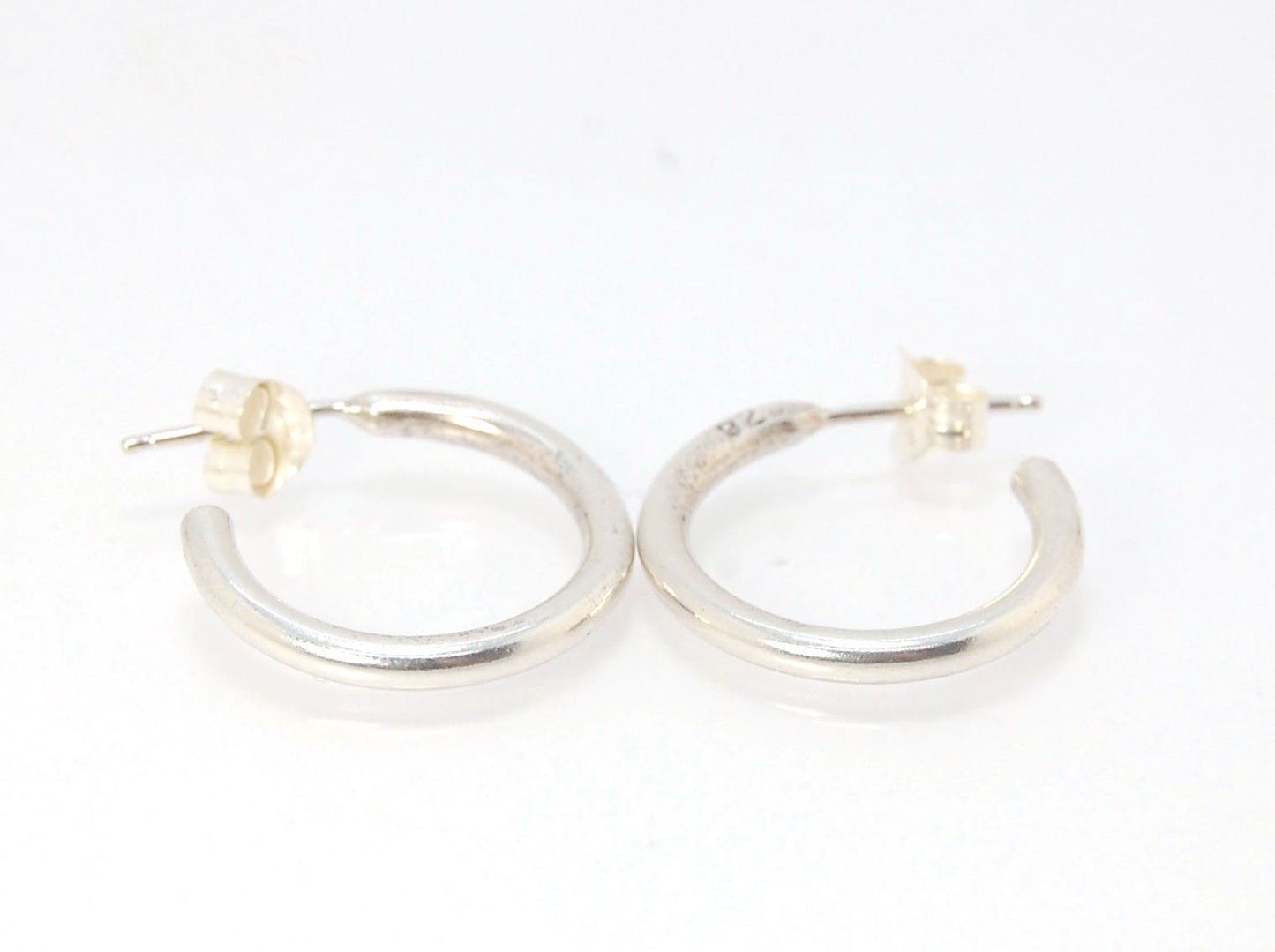 Solid Hoop Post Earrings - Medium - in Sterling These are a nice 3/4“ or 17mm wide post earrings. Made with a solid round rod of sterling silver and some solder posts, these simple and classy sterling silver posts have a nice light weight. Finished with a