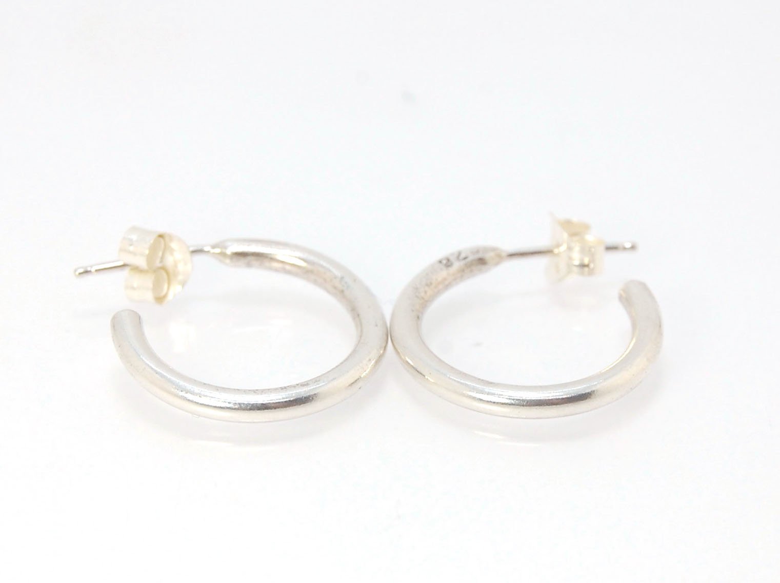 Solid Hoop Post Earrings - Medium - in Sterling These are a nice 3/4“ or 17mm wide post earrings. Made with a solid round rod of sterling silver and some solder posts, these simple and classy sterling silver posts have a nice light weight. Finished with a