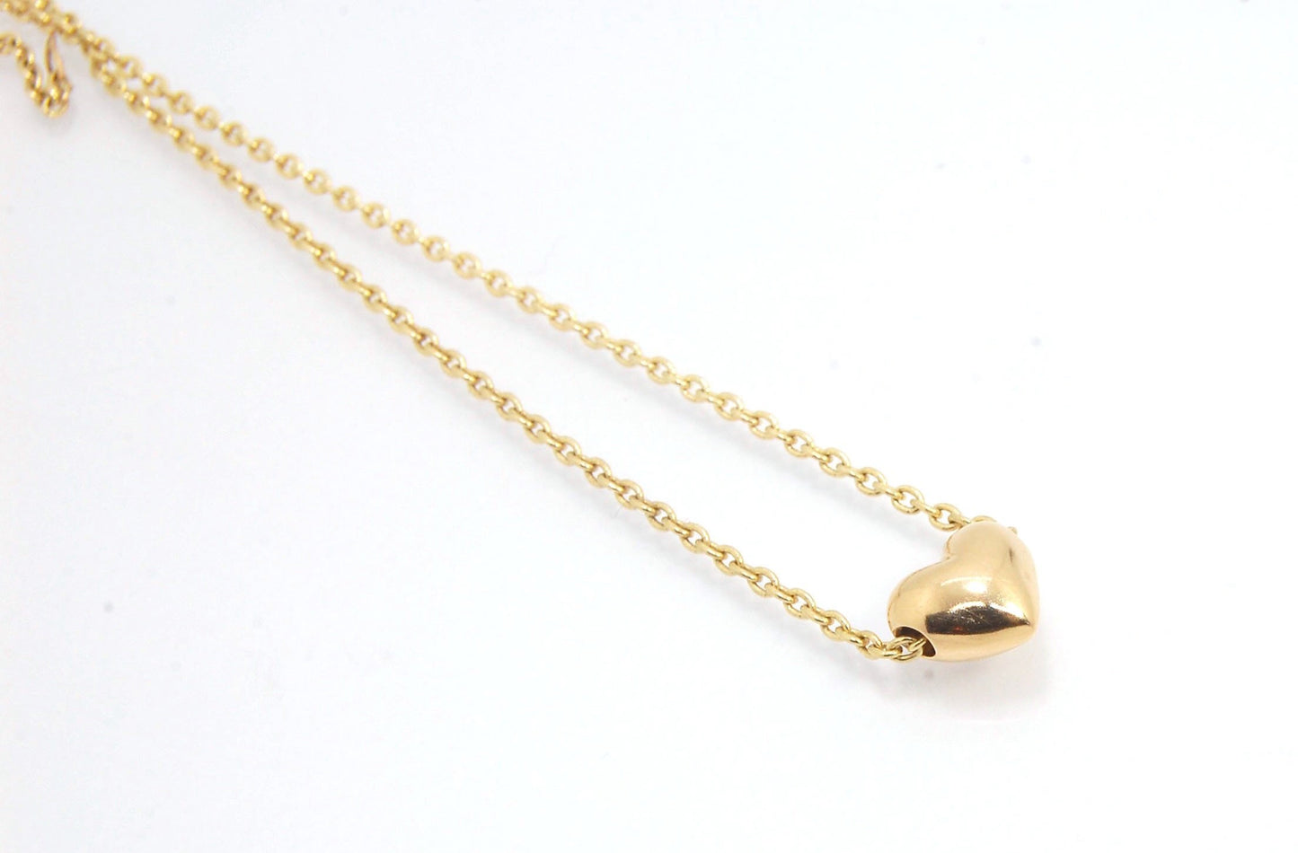 OMG Puffy Heart Slider Pendant in 14k gold OMG! This puffy heart pendant is super cute! I carved this little guy in wax and have been casting them all week!A drilled-out solid puffy heart cast in solid 14k gold and drilled to accommodate a 1.5mm chain. Th