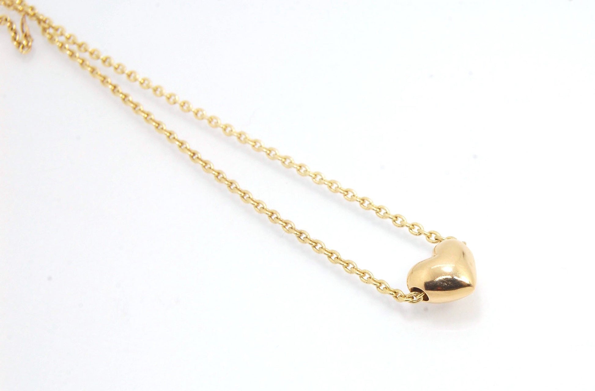 OMG Puffy Heart Slider Pendant in 14k gold OMG! This puffy heart pendant is super cute! I carved this little guy in wax and have been casting them all week!A drilled-out solid puffy heart cast in solid 14k gold and drilled to accommodate a 1.5mm chain. Th