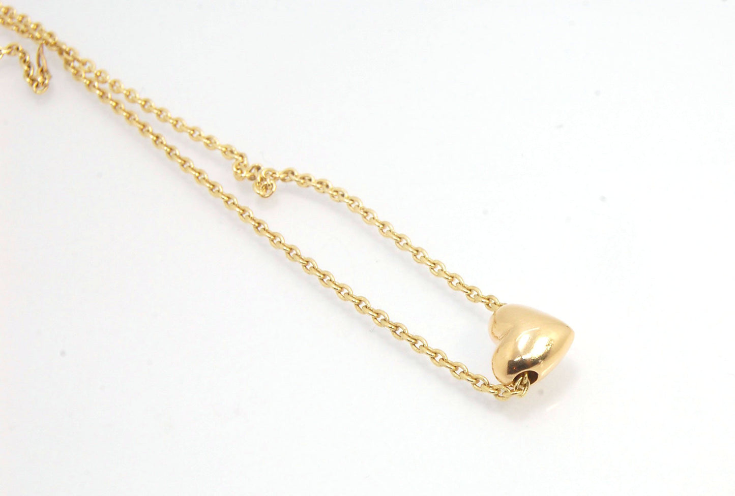 OMG Puffy Heart Slider Pendant in 14k gold OMG! This puffy heart pendant is super cute! I carved this little guy in wax and have been casting them all week!A drilled-out solid puffy heart cast in solid 14k gold and drilled to accommodate a 1.5mm chain. Th