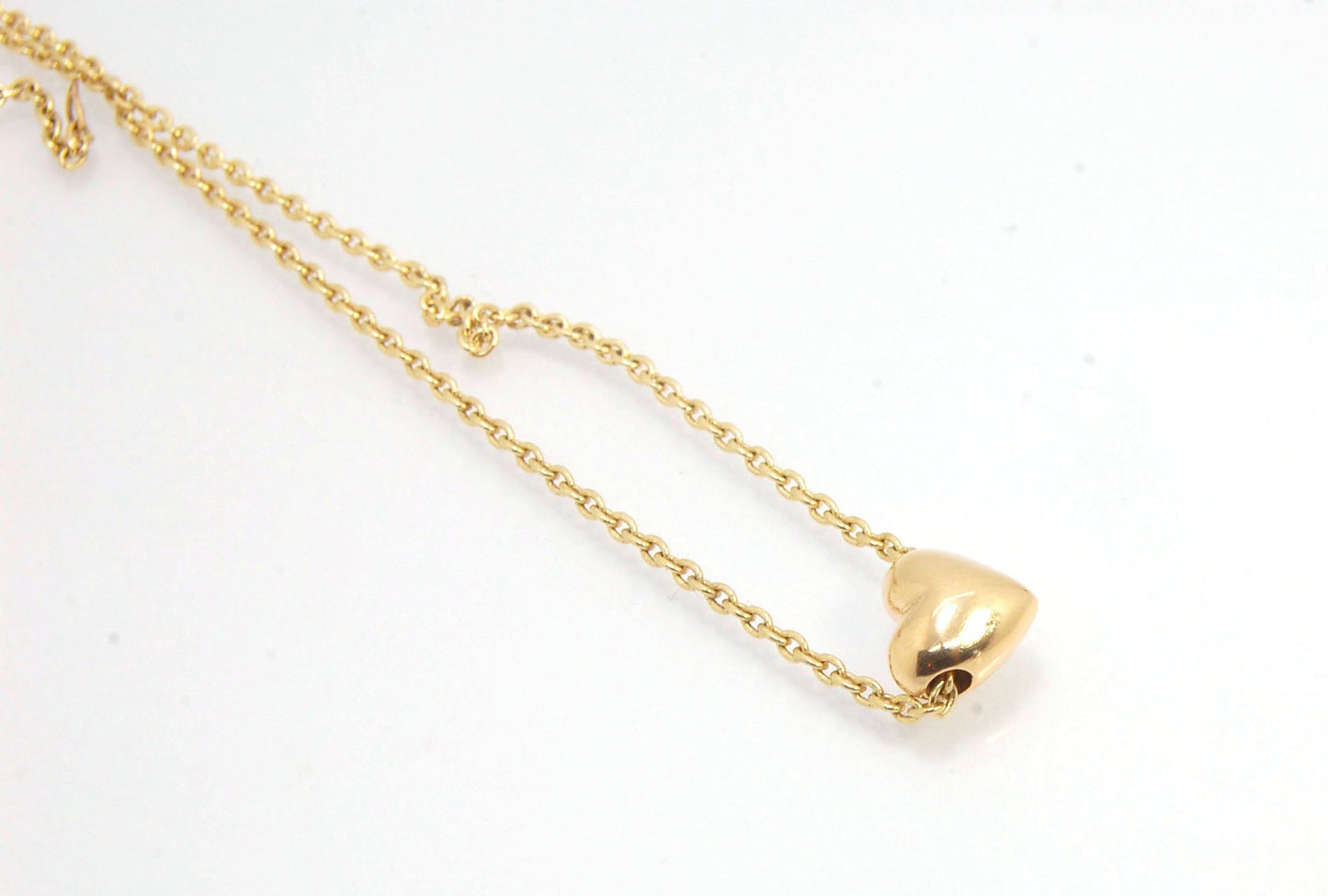 OMG Puffy Heart Slider Pendant in 14k gold OMG! This puffy heart pendant is super cute! I carved this little guy in wax and have been casting them all week!A drilled-out solid puffy heart cast in solid 14k gold and drilled to accommodate a 1.5mm chain. Th