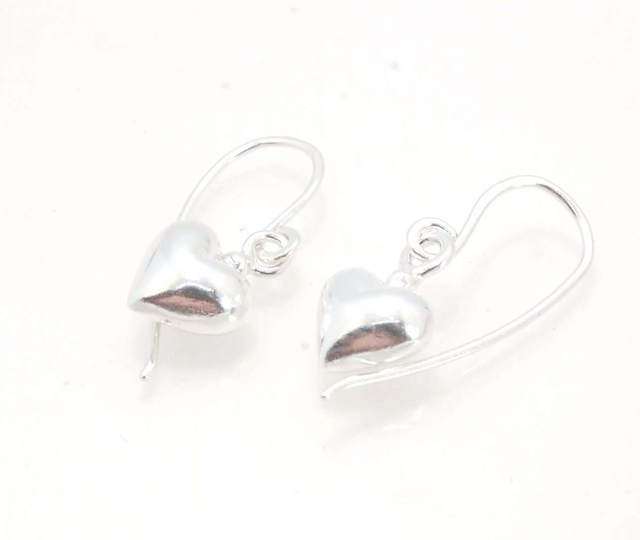 Puffy Heart Dangles - Large - Oxidized These terrific heart dangle earrings are cast from a wax carved original and are cast using the lost wax process. I then make a mold, then a wax copy, and through the process of lost wax casting I make these cast ear