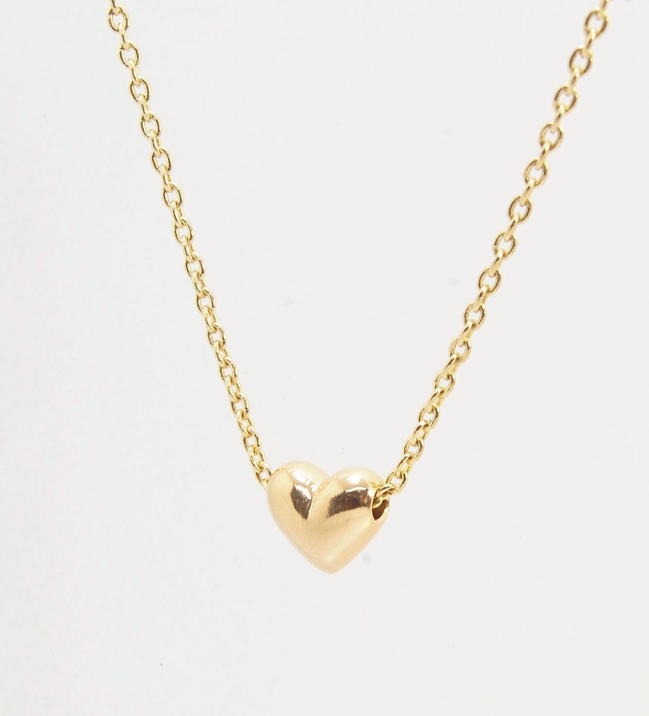 OMG Puffy Heart Slider Pendant in 14k gold OMG! This puffy heart pendant is super cute! I carved this little guy in wax and have been casting them all week!A drilled-out solid puffy heart cast in solid 14k gold and drilled to accommodate a 1.5mm chain. Th