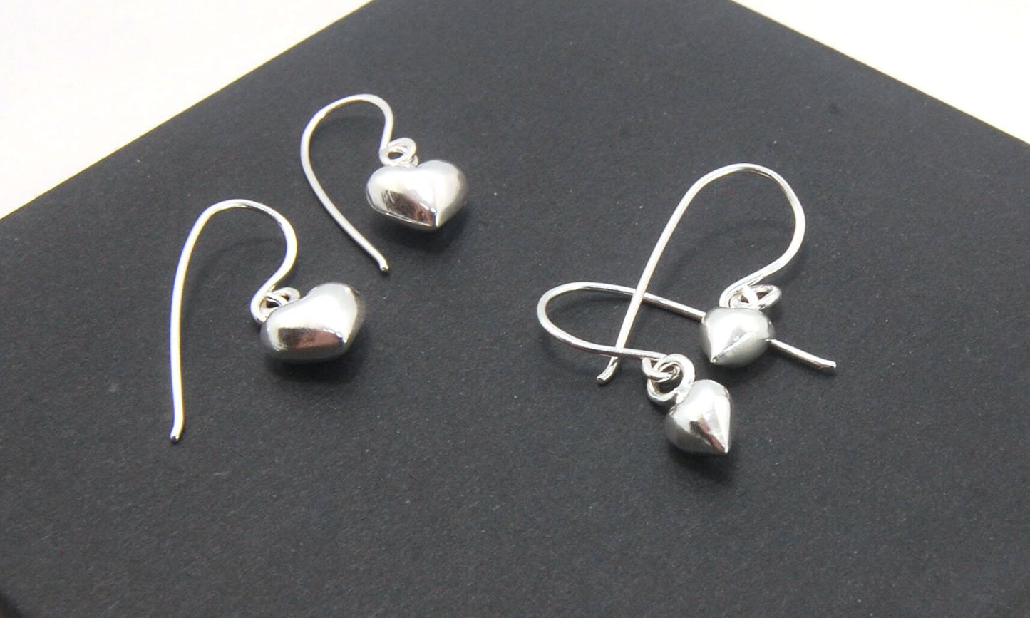 Puffy Heart Dangles - Small - Shiny These terrific heart dangle earrings are cast from a wax carved original and are cast using the lost wax process. I then make a mold, then a wax copy, and through the process of lost wax casting I make these cast earrin