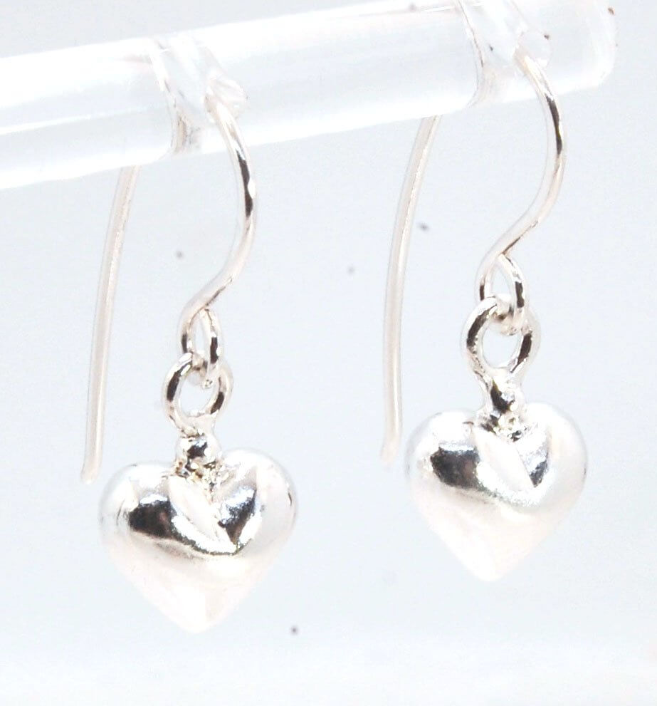 Puffy Heart Dangles - Large - Oxidized These terrific heart dangle earrings are cast from a wax carved original and are cast using the lost wax process. I then make a mold, then a wax copy, and through the process of lost wax casting I make these cast ear