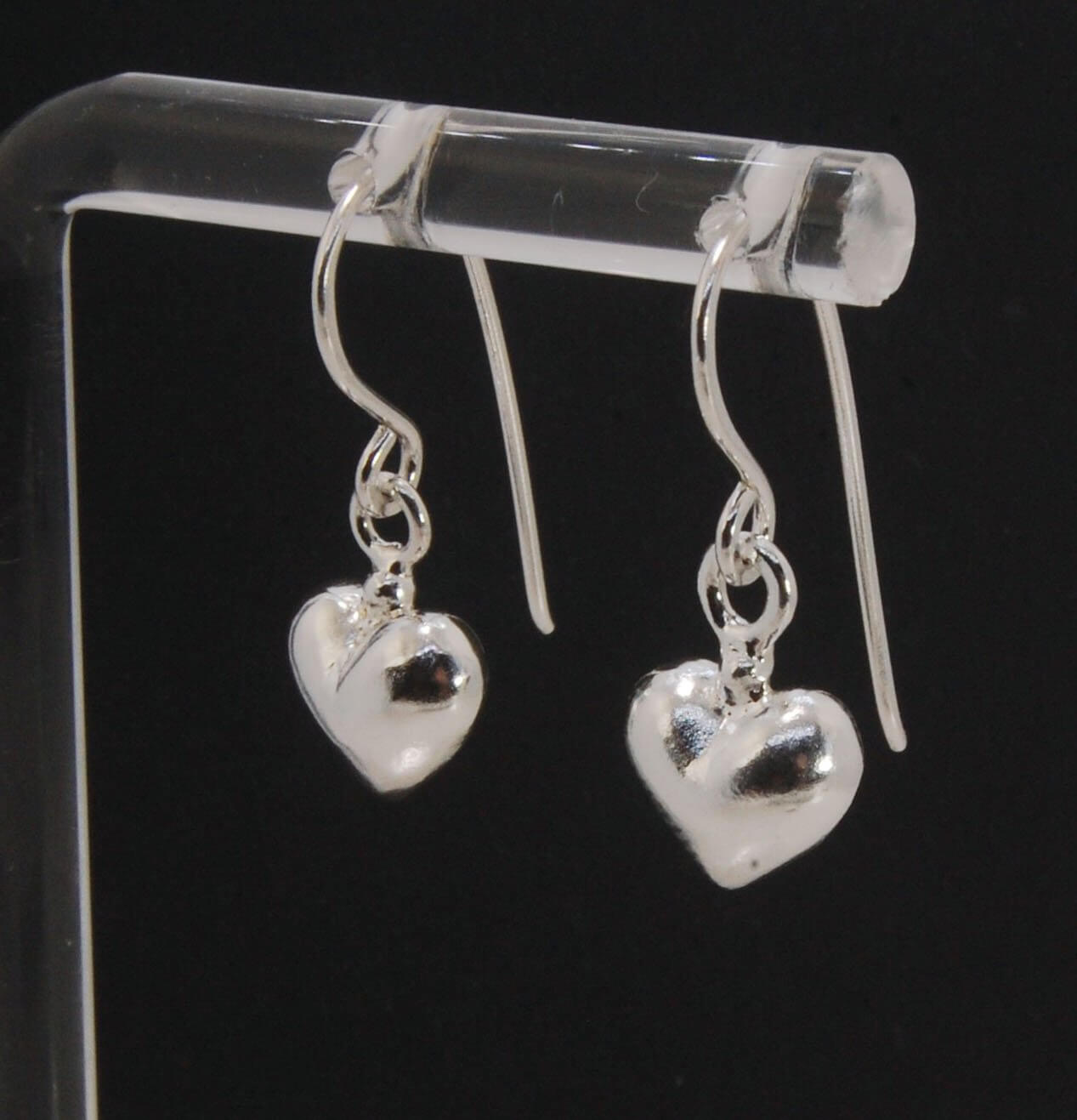 Puffy Heart Dangles - Large - Oxidized These terrific heart dangle earrings are cast from a wax carved original and are cast using the lost wax process. I then make a mold, then a wax copy, and through the process of lost wax casting I make these cast ear