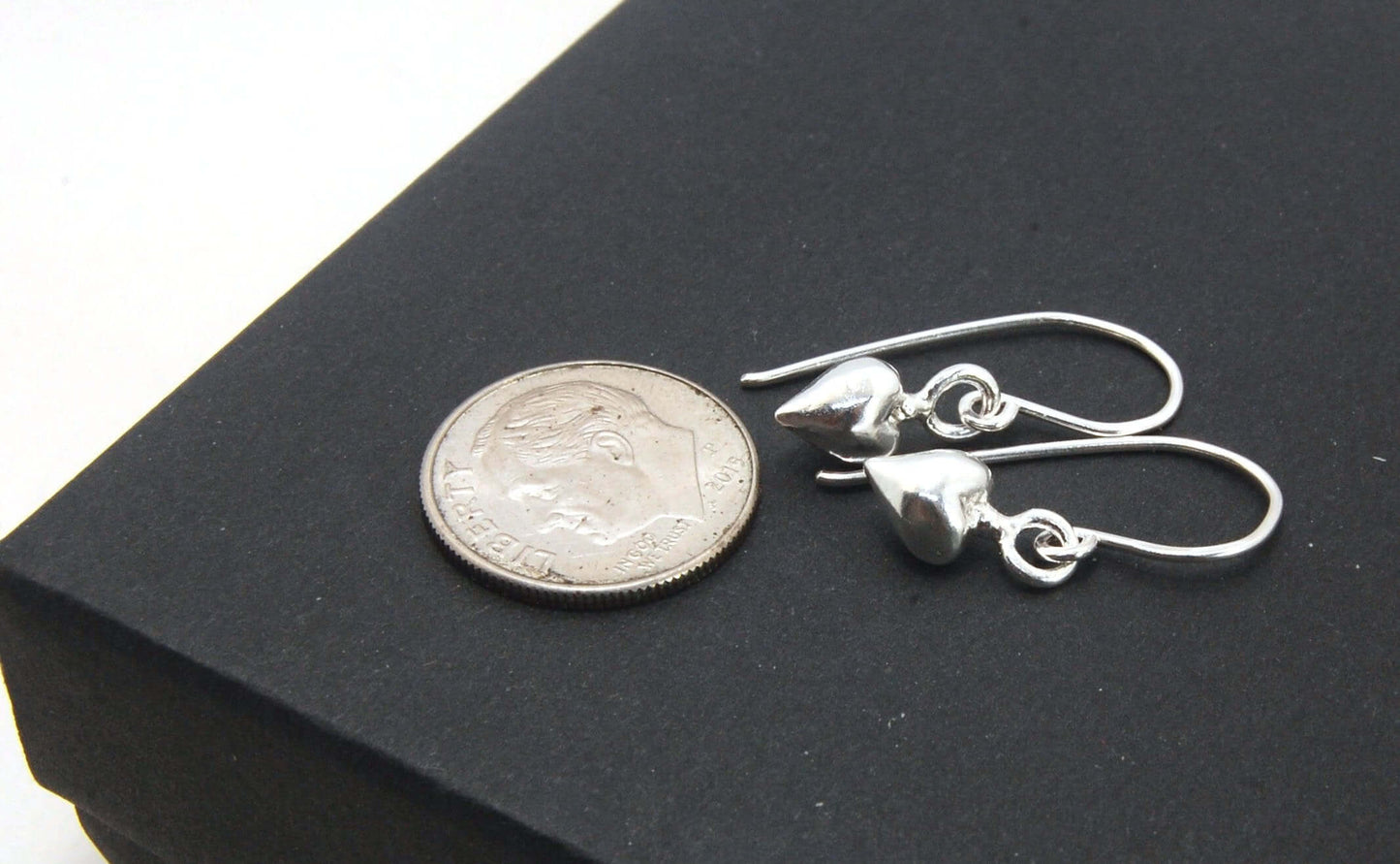 Puffy Heart Dangles - Small - Shiny These terrific heart dangle earrings are cast from a wax carved original and are cast using the lost wax process. I then make a mold, then a wax copy, and through the process of lost wax casting I make these cast earrin