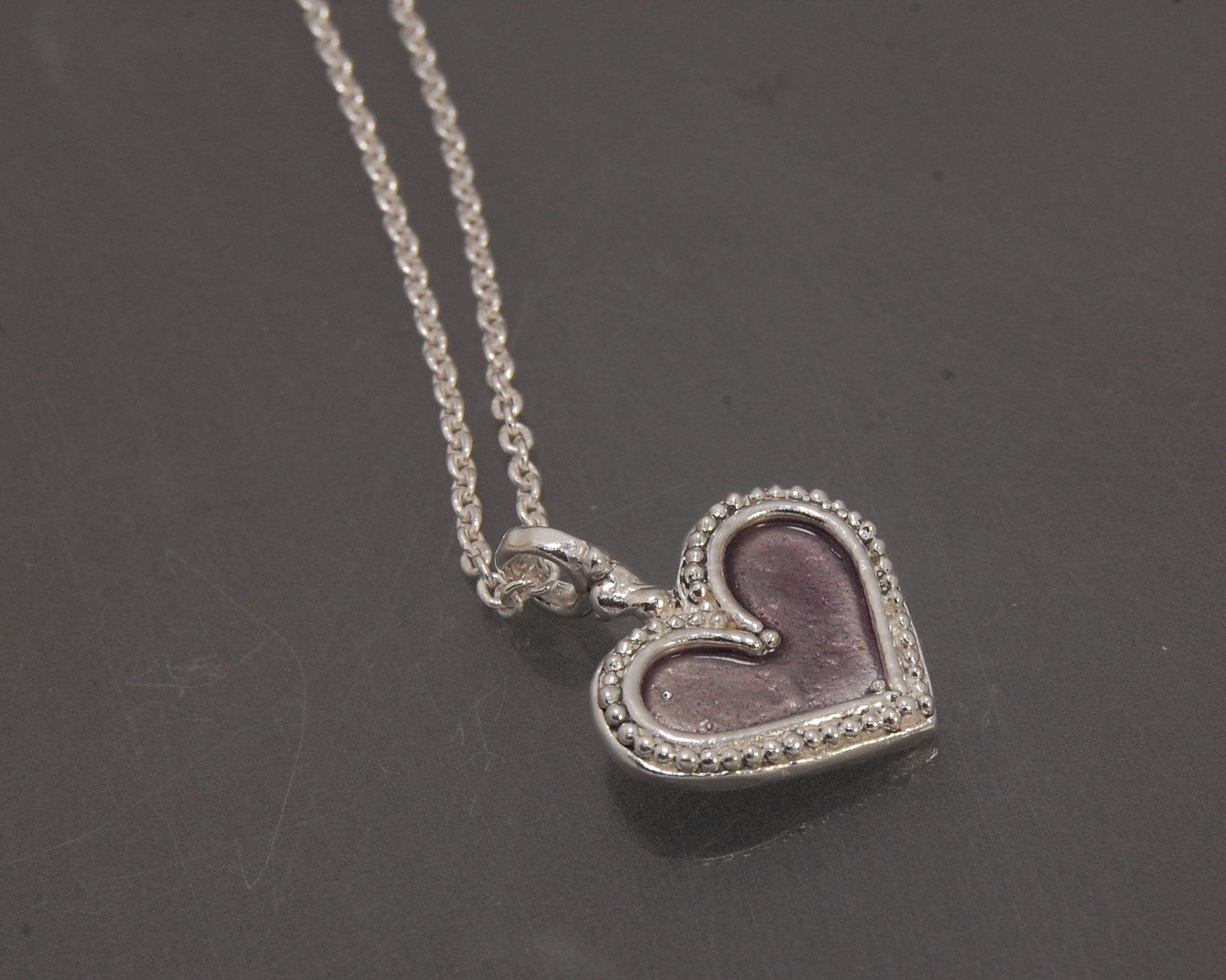 Enamel Heart Charm in Fine SIlver It’s a HEART of fine silver granulation that I made a mold of, then cast, then enameled! In your choice of colors: Red, Purple, Green, Black, Azalea, HollyhockGranulation is an ancient fusing process utilized for thousand