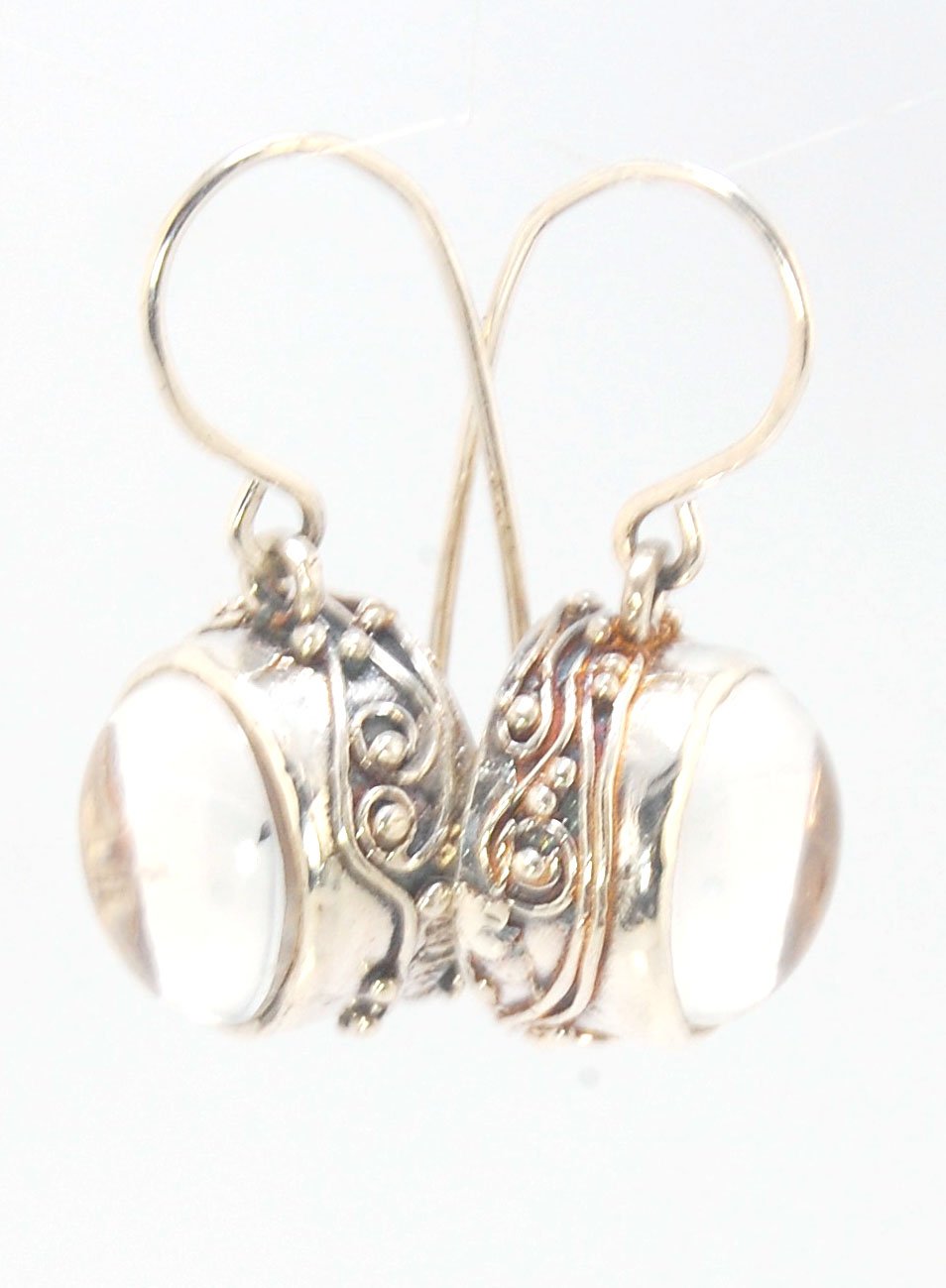 Clear Quartz Swirled Earrings with French Hook in Sterling - Large - 15mm These are cast in my studio using the ancient technique of lost wax casting with a wax model molded from an original granulated piece of fine silver.These clear quartz cabochon earr