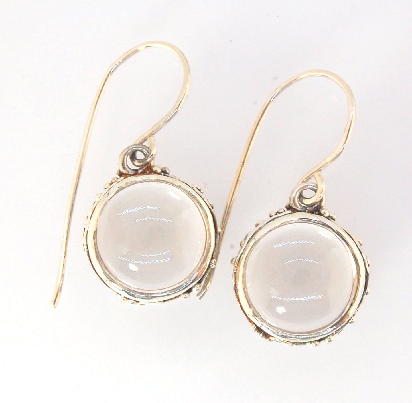 Clear Quartz Swirled Earrings with French Hook in Sterling - Large - 15mm These are cast in my studio using the ancient technique of lost wax casting with a wax model molded from an original granulated piece of fine silver.These clear quartz cabochon earr