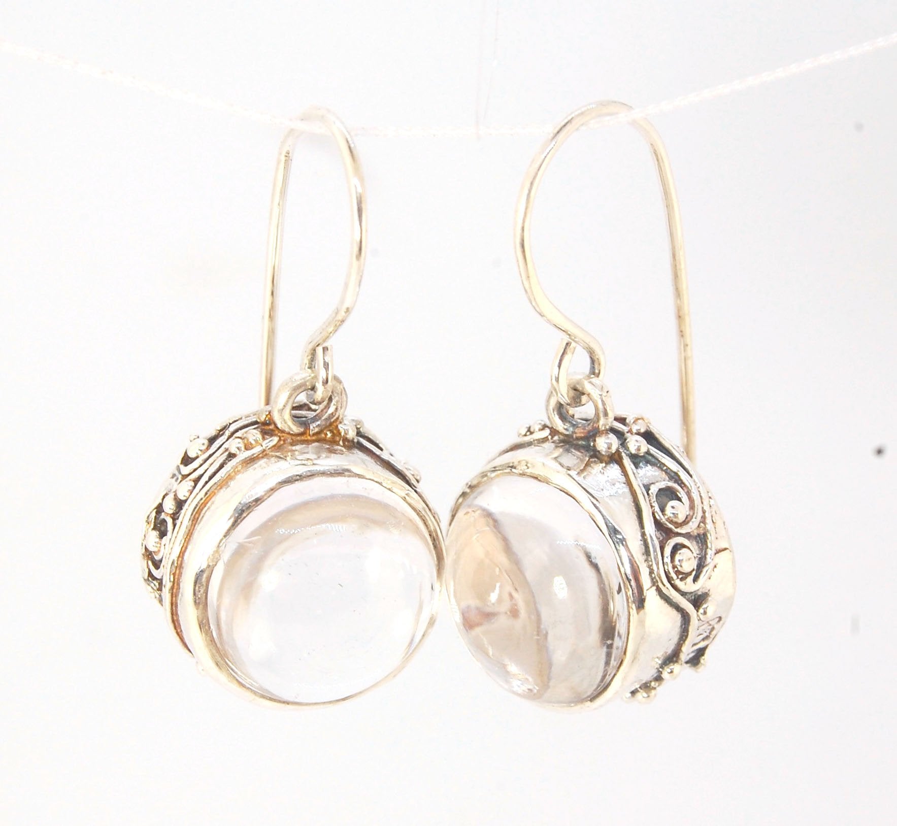 Clear Quartz Swirled Earrings with French Hook in Sterling - Large - 15mm These are cast in my studio using the ancient technique of lost wax casting with a wax model molded from an original granulated piece of fine silver.These clear quartz cabochon earr