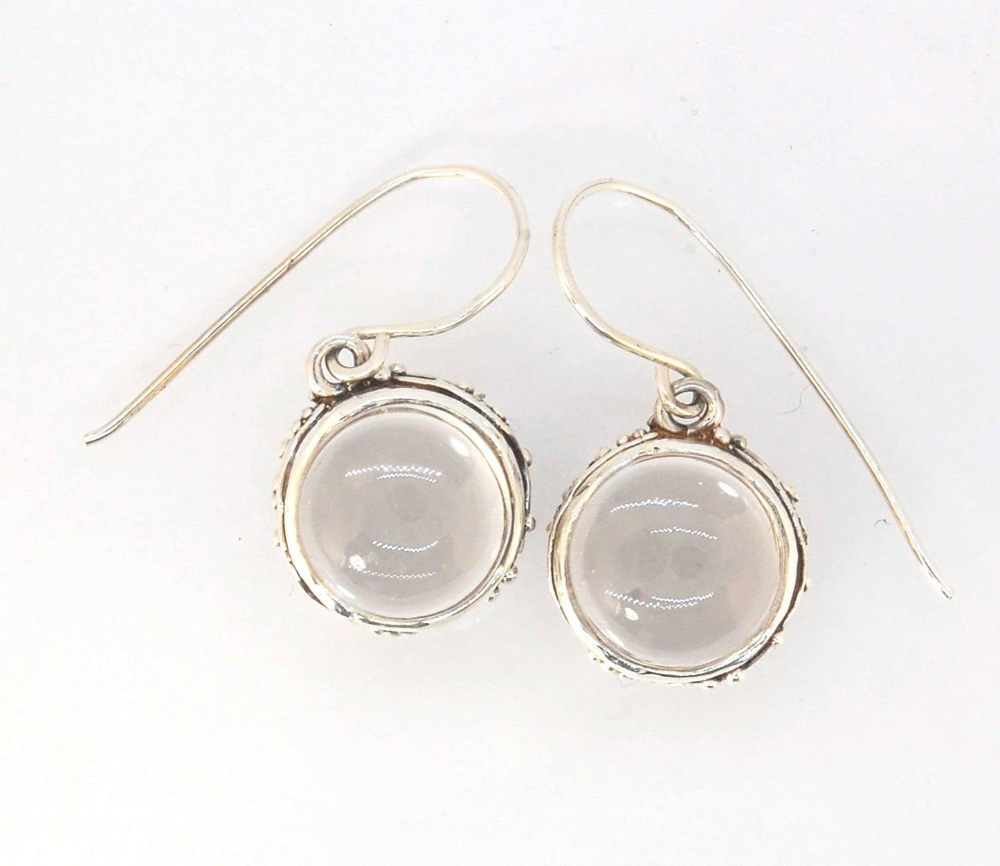 Clear Quartz Swirled Earrings with French Hook in Sterling - Large - 15mm These are cast in my studio using the ancient technique of lost wax casting with a wax model molded from an original granulated piece of fine silver.These clear quartz cabochon earr