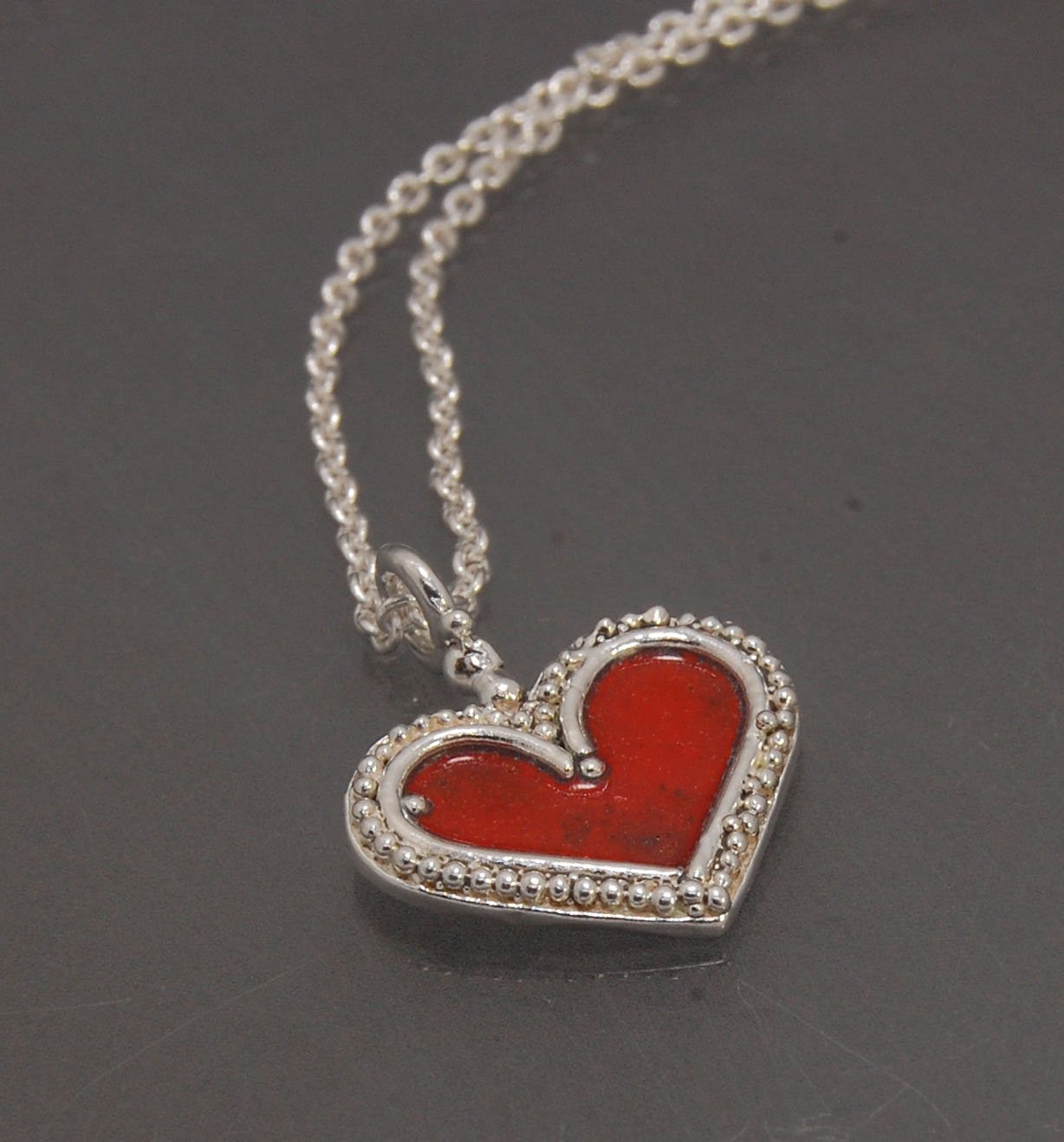 Enamel Heart Charm in Fine SIlver It’s a HEART of fine silver granulation that I made a mold of, then cast, then enameled! In your choice of colors: Red, Purple, Green, Black, Azalea, HollyhockGranulation is an ancient fusing process utilized for thousand