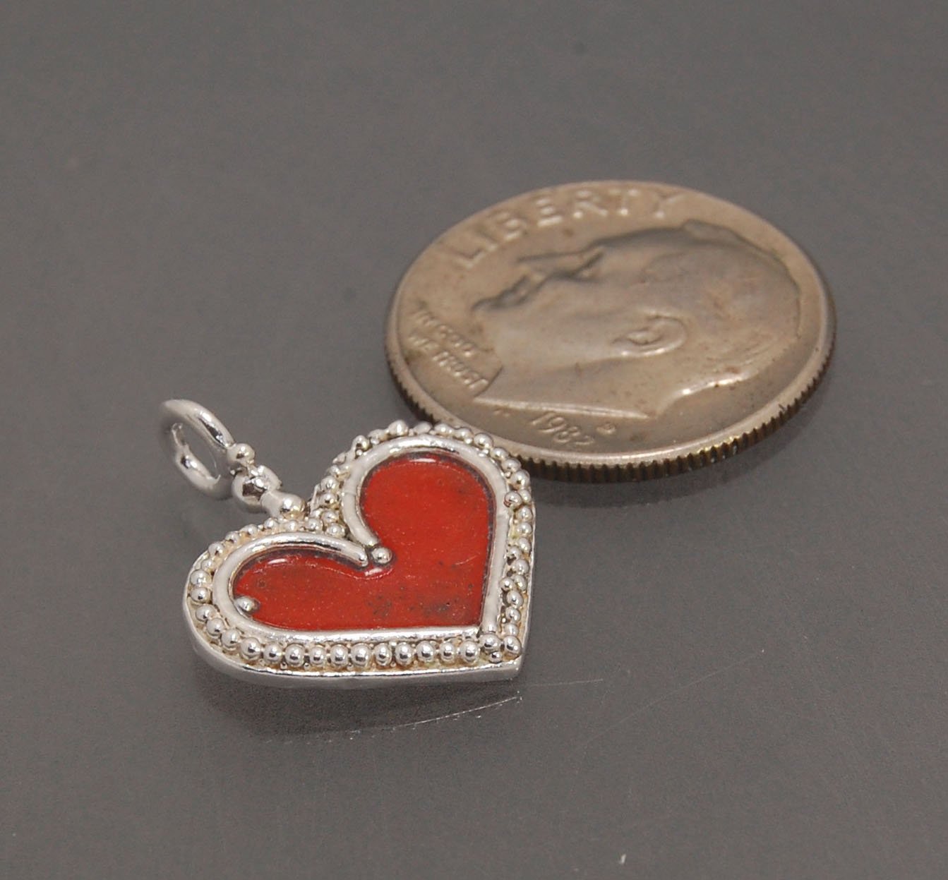 Enamel Heart Charm in Fine SIlver It’s a HEART of fine silver granulation that I made a mold of, then cast, then enameled! In your choice of colors: Red, Purple, Green, Black, Azalea, HollyhockGranulation is an ancient fusing process utilized for thousand