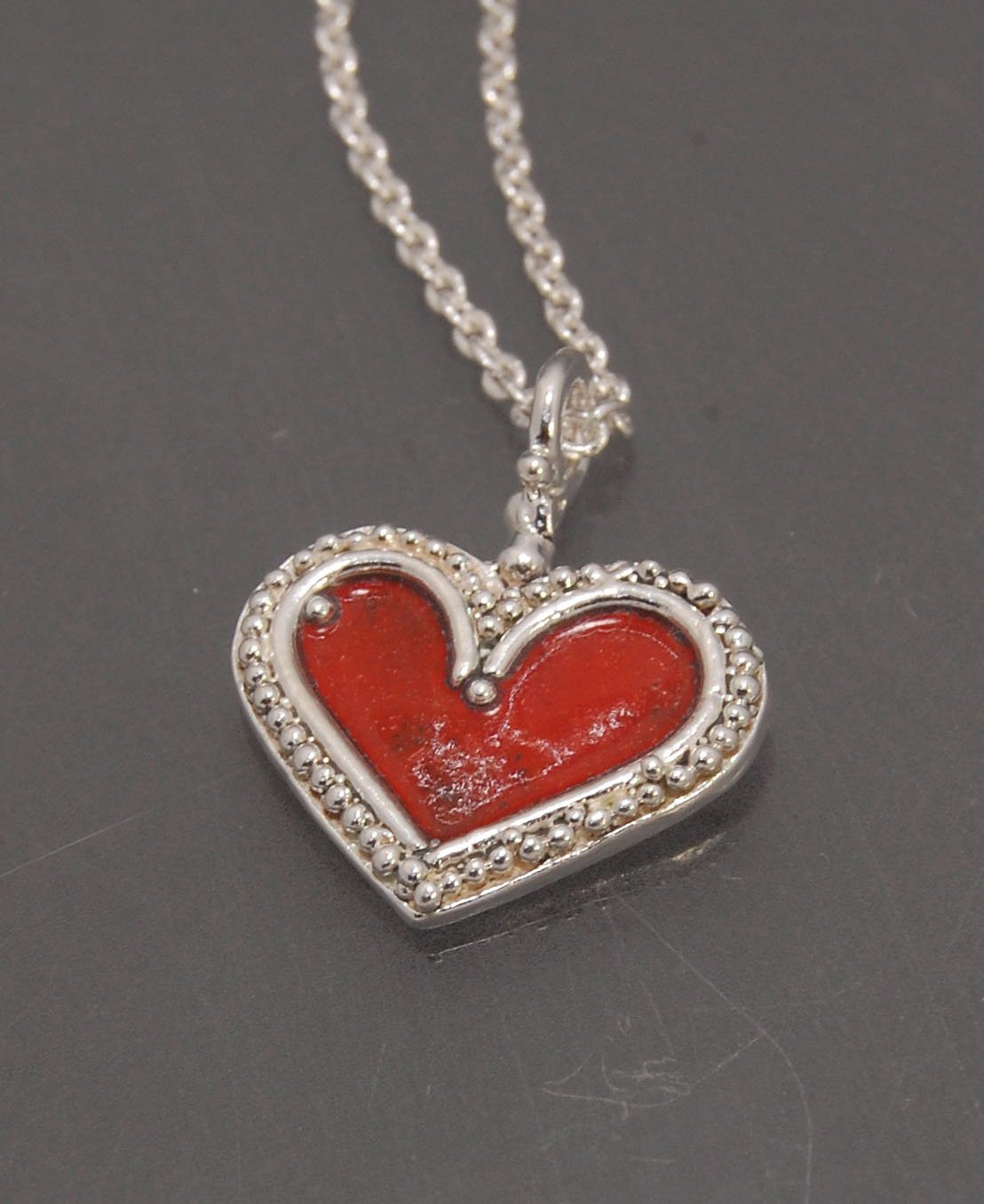 Enamel Heart Charm in Fine SIlver It’s a HEART of fine silver granulation that I made a mold of, then cast, then enameled! In your choice of colors: Red, Purple, Green, Black, Azalea, HollyhockGranulation is an ancient fusing process utilized for thousand